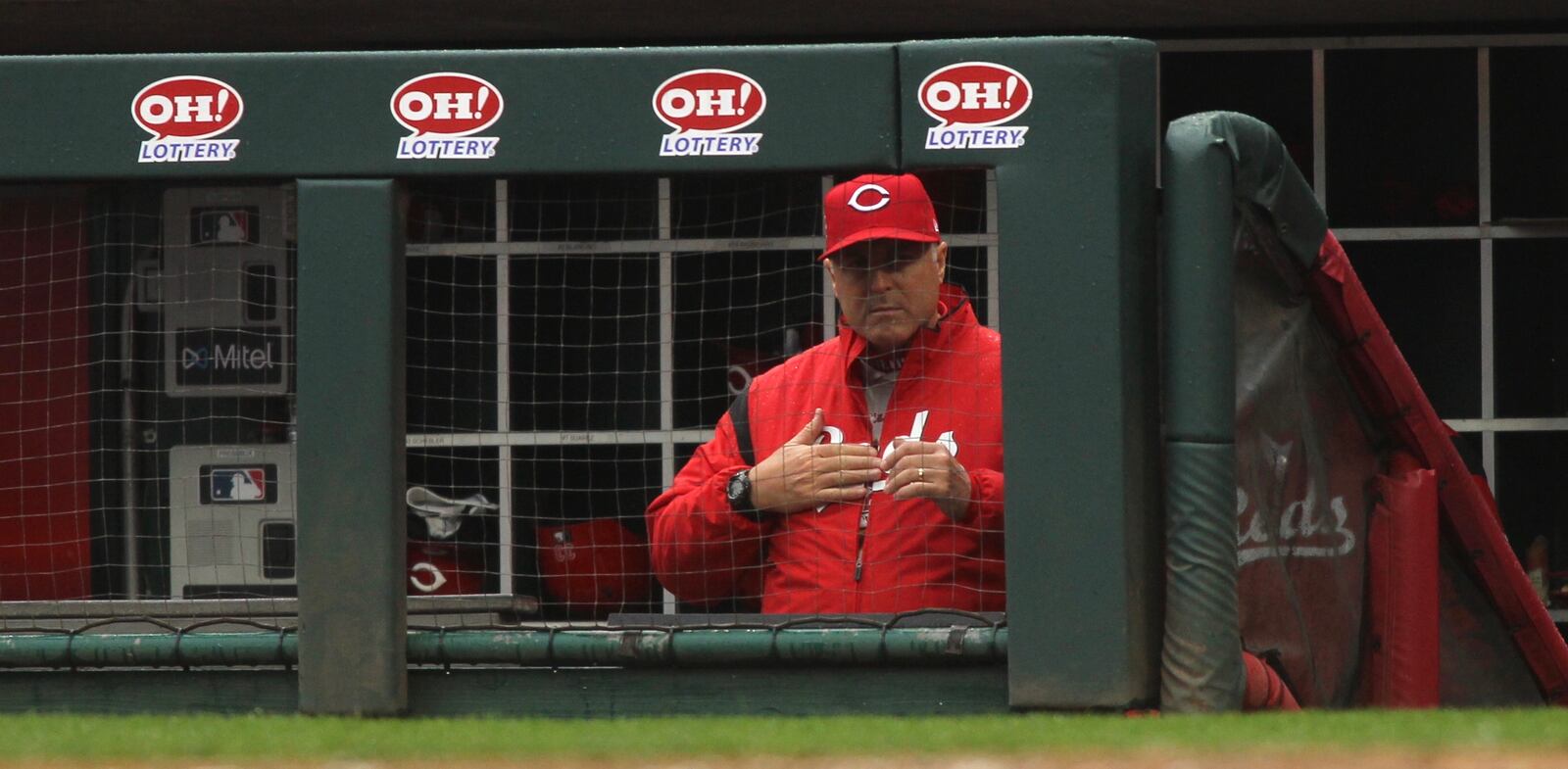 Reds manager Bryan Price calls a sign during a game against the Cardinals on Sunday, April 15, 2018, at Great American Ball Park in Cincinnati.