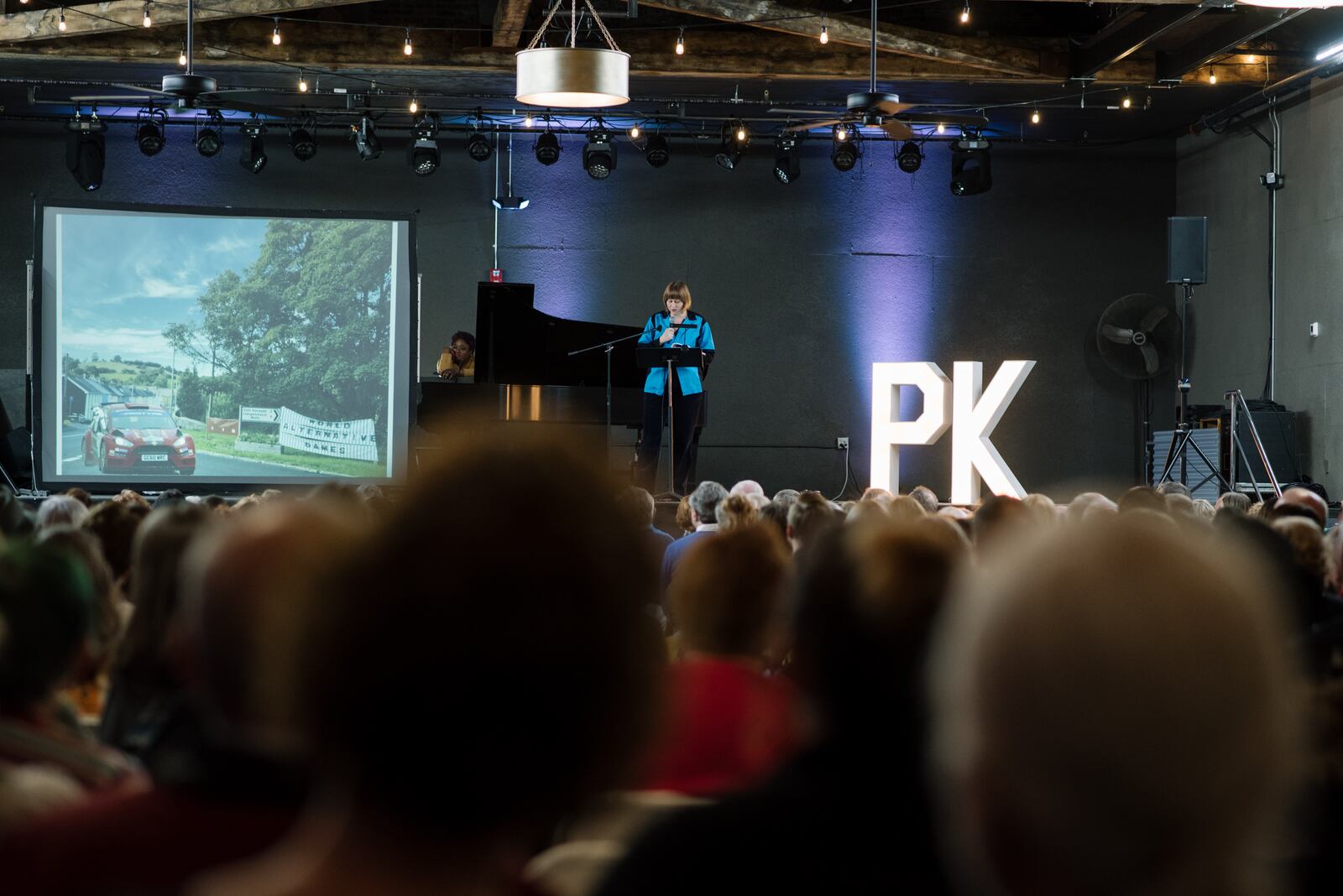 Shayna McConville presents at PechaKucha Dayton at the Brightside. She has been a co-organizer of the series since 2012.