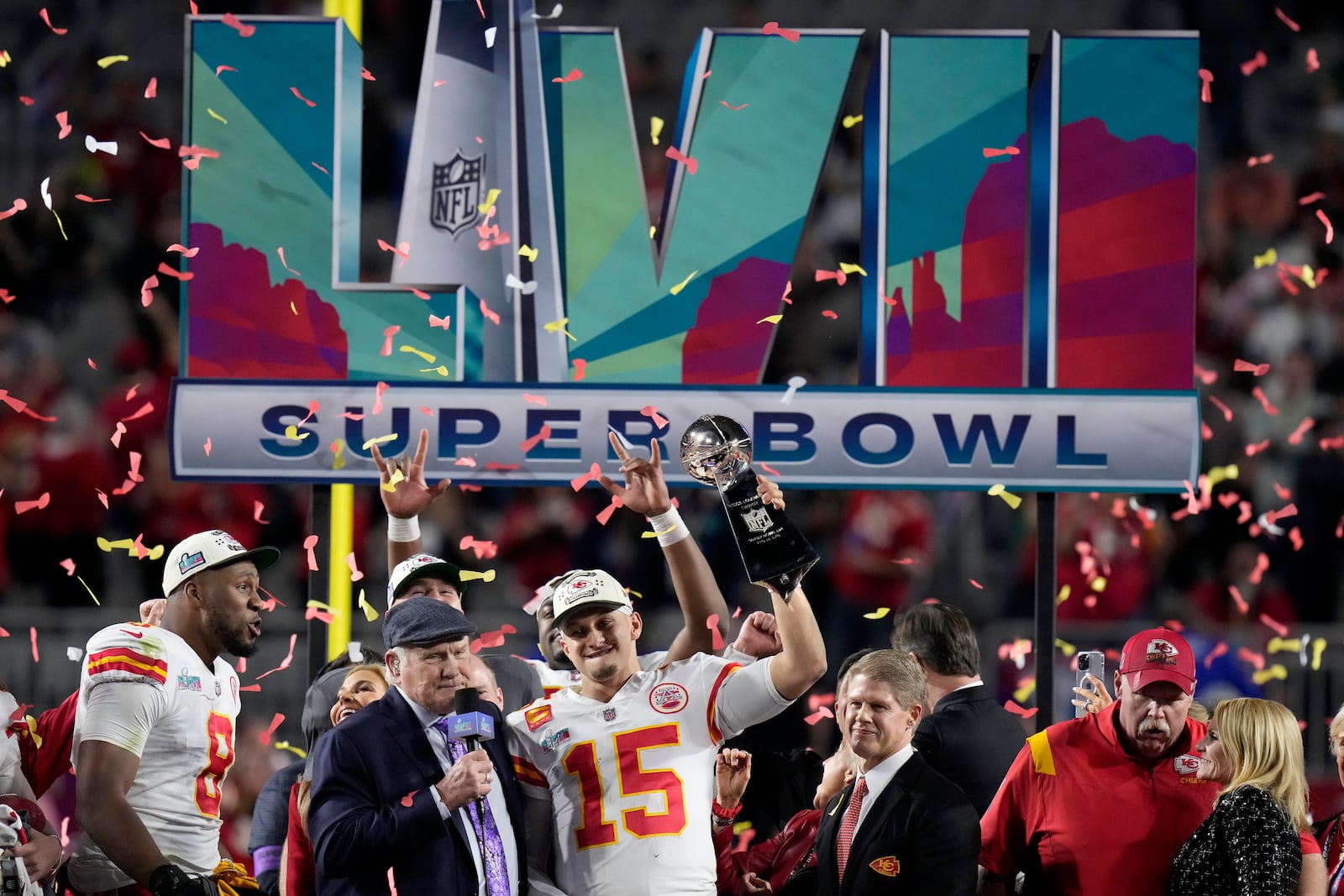 FILE - Kansas City Chiefs quarterback Patrick Mahomes (15) holds the Vince Lombardi Trophy while talking to Terry Bradshaw following the NFL Super Bowl 57 football game against the Philadelphia Eagles, Sunday, Feb. 12, 2023, in Glendale, Ariz. (AP Photo/Seth Wenig, File)