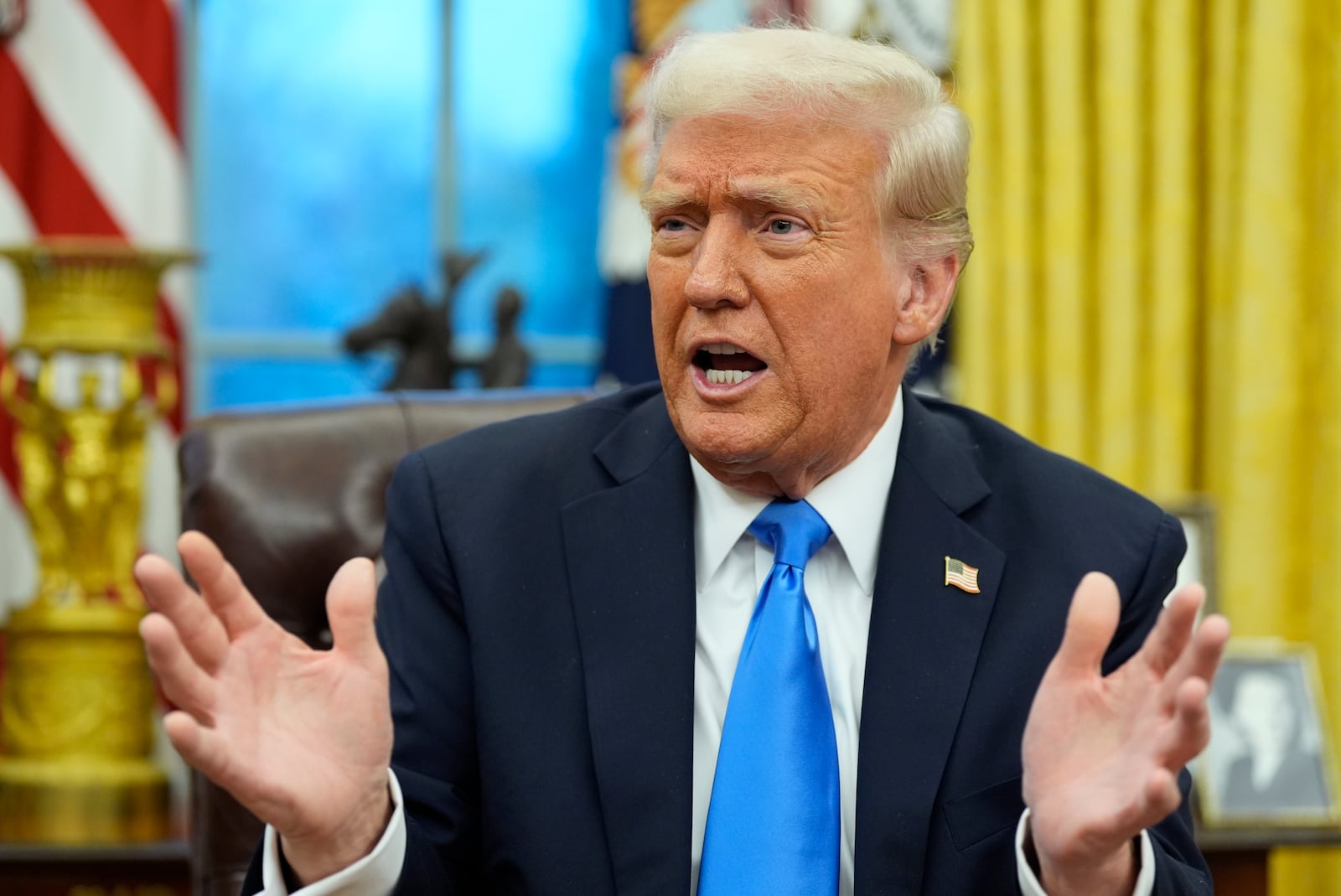 President Donald Trump speaks with reporters in the Oval Office at the White House, Tuesday, Feb. 11, 2025, in Washington. (Photo/Alex Brandon)