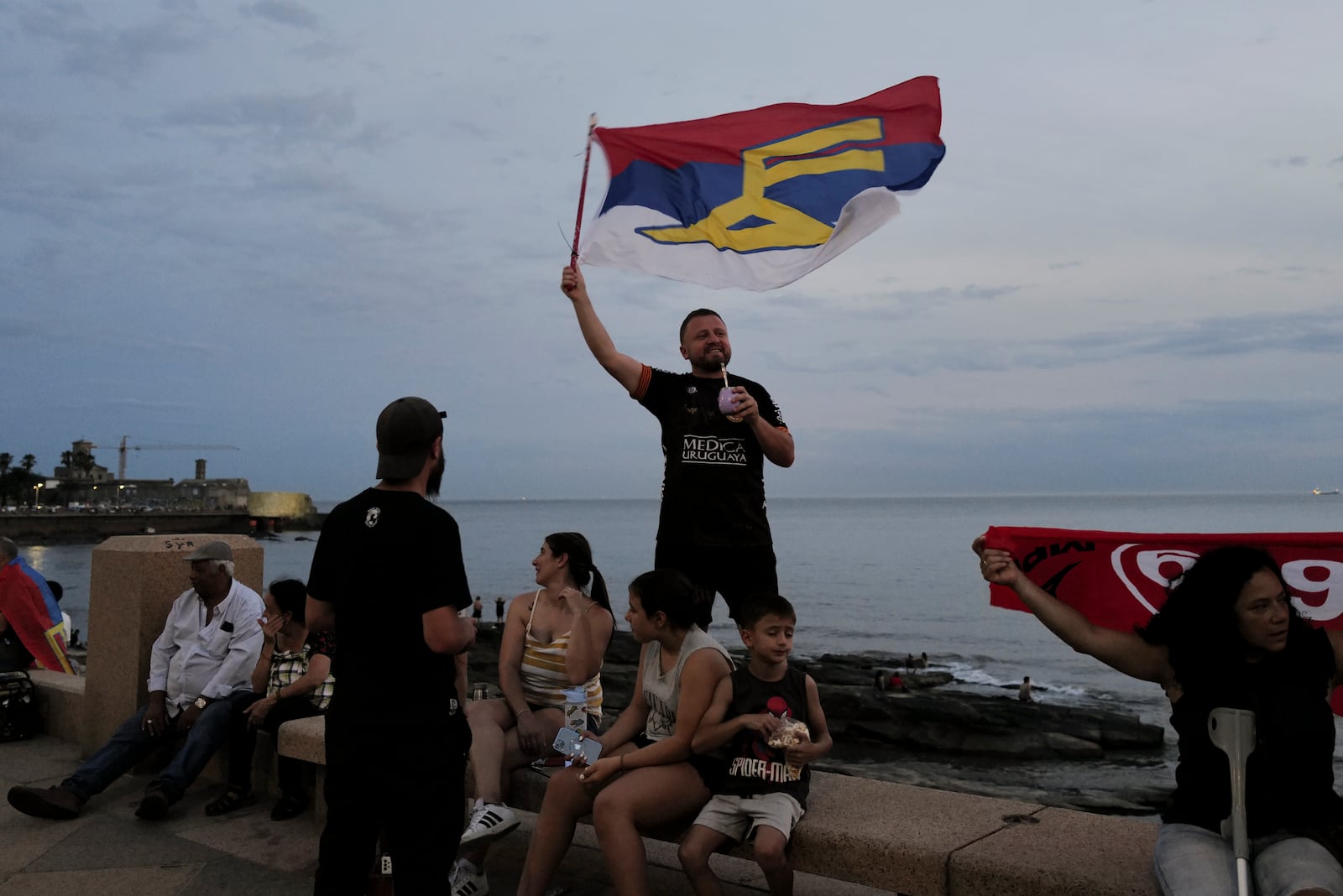 Supporters of the Broad Front (Frente Amplio) celebrate the victory of candidate Yamandú Orsi in the presidential run-off election in Montevideo, Uruguay, Sunday, Nov. 24, 2024. (AP Photo/Jon Orbach)