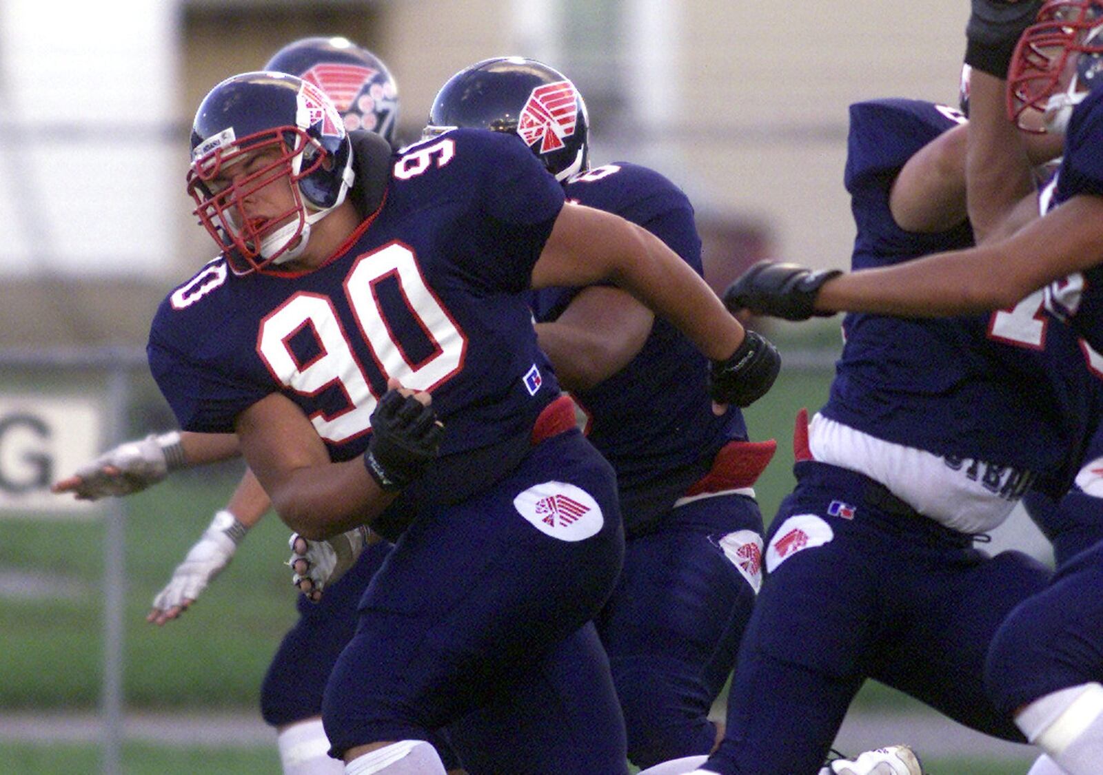 Piqua defensive lineman Quinn Pitcock breaks through the offensive line during warmups before the Indians game against Vandalia. DDN FILE