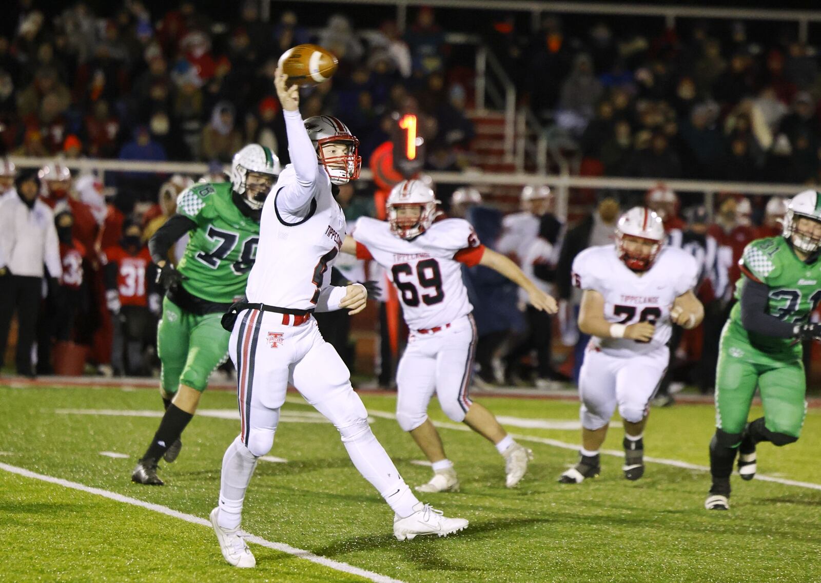 Tippecanoe quarterback Liam Poronsky throws the ball during their Division III Regional Final football game against Badin Friday, Nov. 18, 2022 at Trotwood-Madison High School. NICK GRAHAM/STAFF