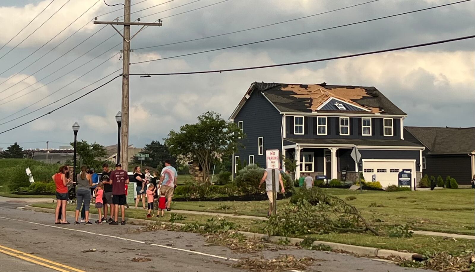 Tipp City residents check on each other an hour after a tornado hit parts of the town around 6 pm Wednesday, June 8, 2022. AIMEE HANCOCK / STAFF