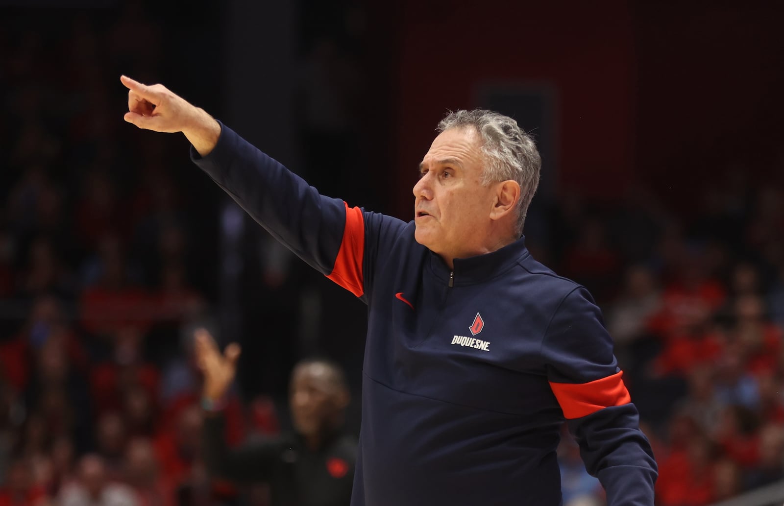 Duquesne's Keith Dambrot coaches during a game against Dayton on Tuesday, Feb. 13, 2024, at UD Arena. David Jablonski/Staff