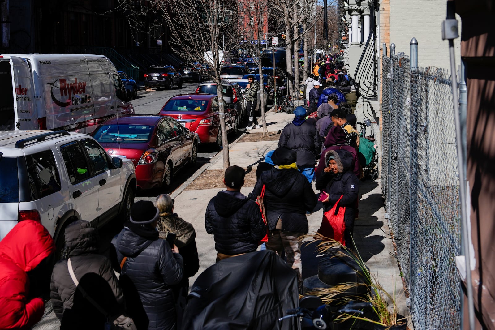 People wait in line to receive free eggs from FarmerJawn Agriculture, Friday, March 21, 2025, in the Harlem neighborhood of New York. (AP Photo/Julia Demaree Nikhinson)