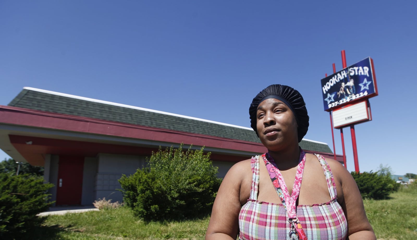 Crystal Newsome, 27, said she’s against a medical marijuana dispensary moving into her neighborhood. The site that was once the Hookah Star at 1875 Needmore Rd. was granted a provisional license to sell medical marijuana. CHRIS STEWART / STAFF