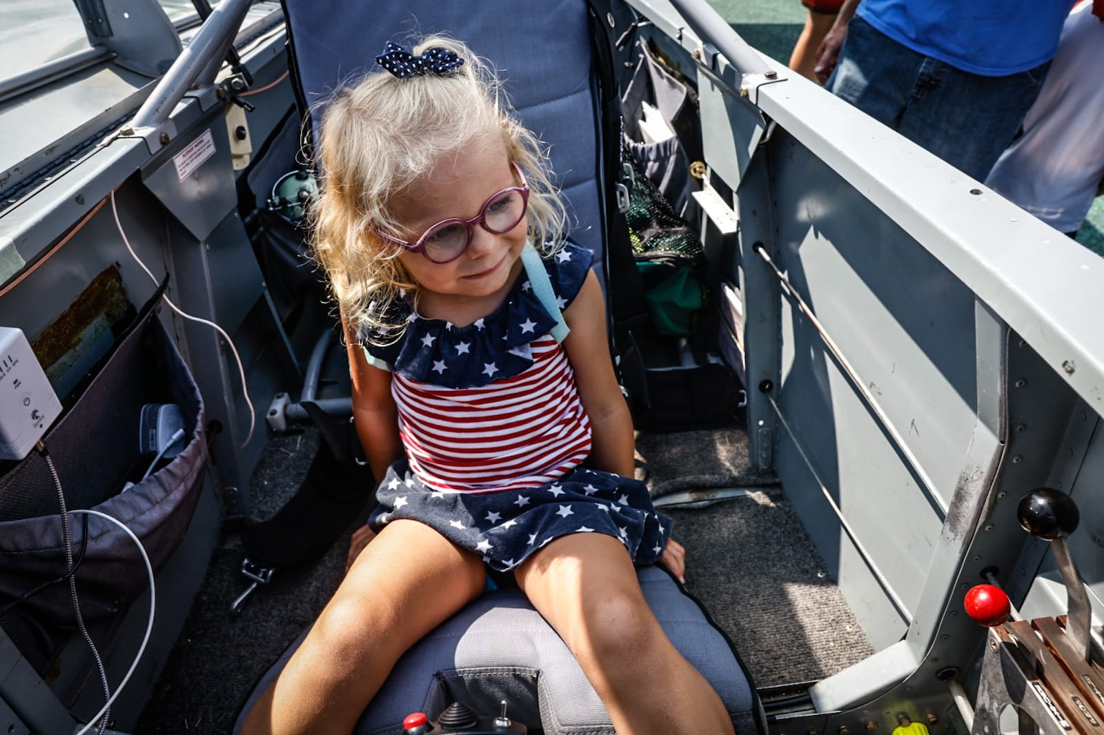 Hattie Brook from Englewood checks-out one of many display planes at the Dayton Air Show. Jim Noelker/Staff