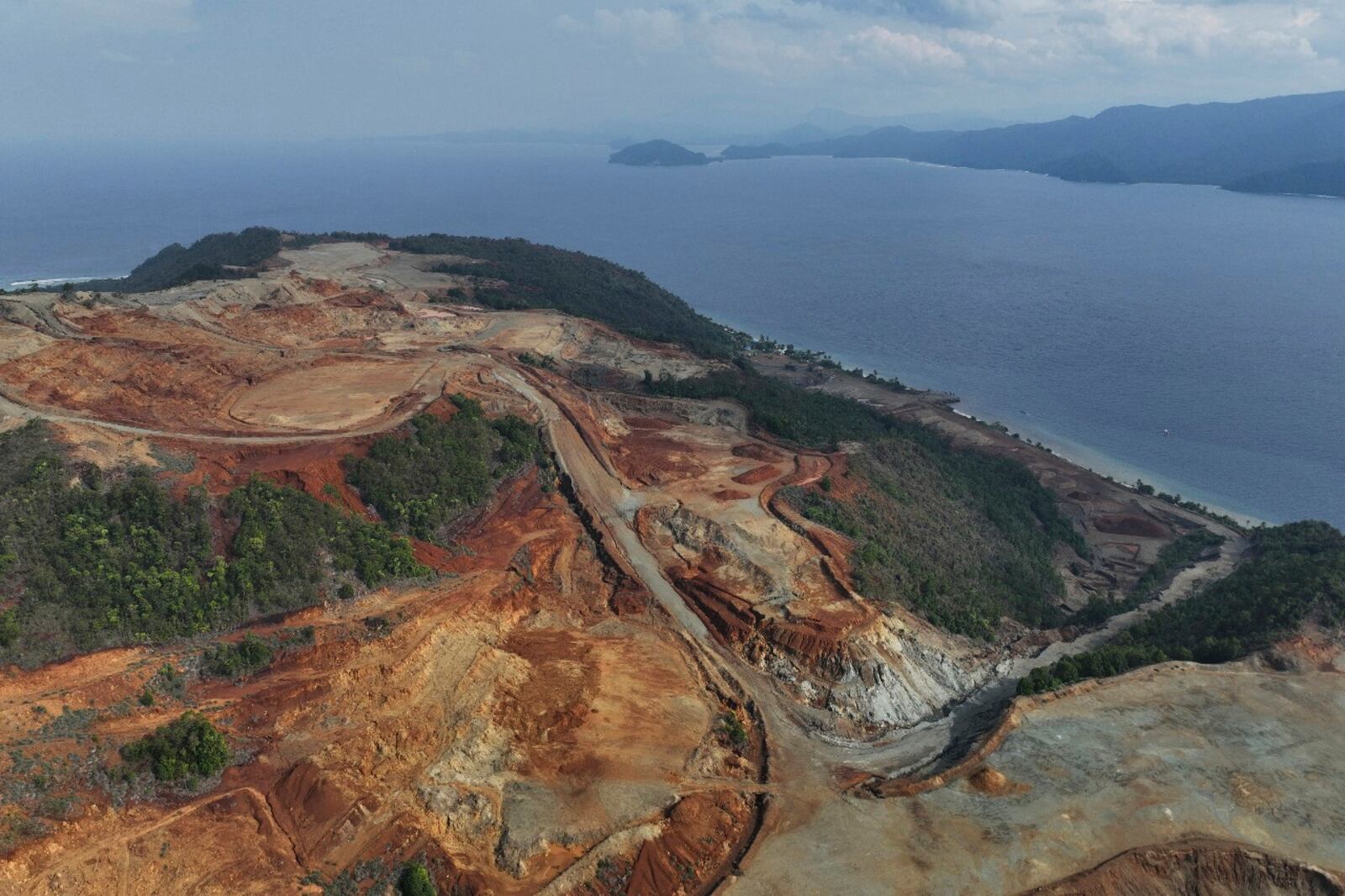 In this photo provided by Auriga Nusantara, Deforestation is visible on Manuram Island, Indonesia, in the mining area of PT Anugerah Surya Pratama on Dec. 18, 2024. (Auriga Nusantara via AP)