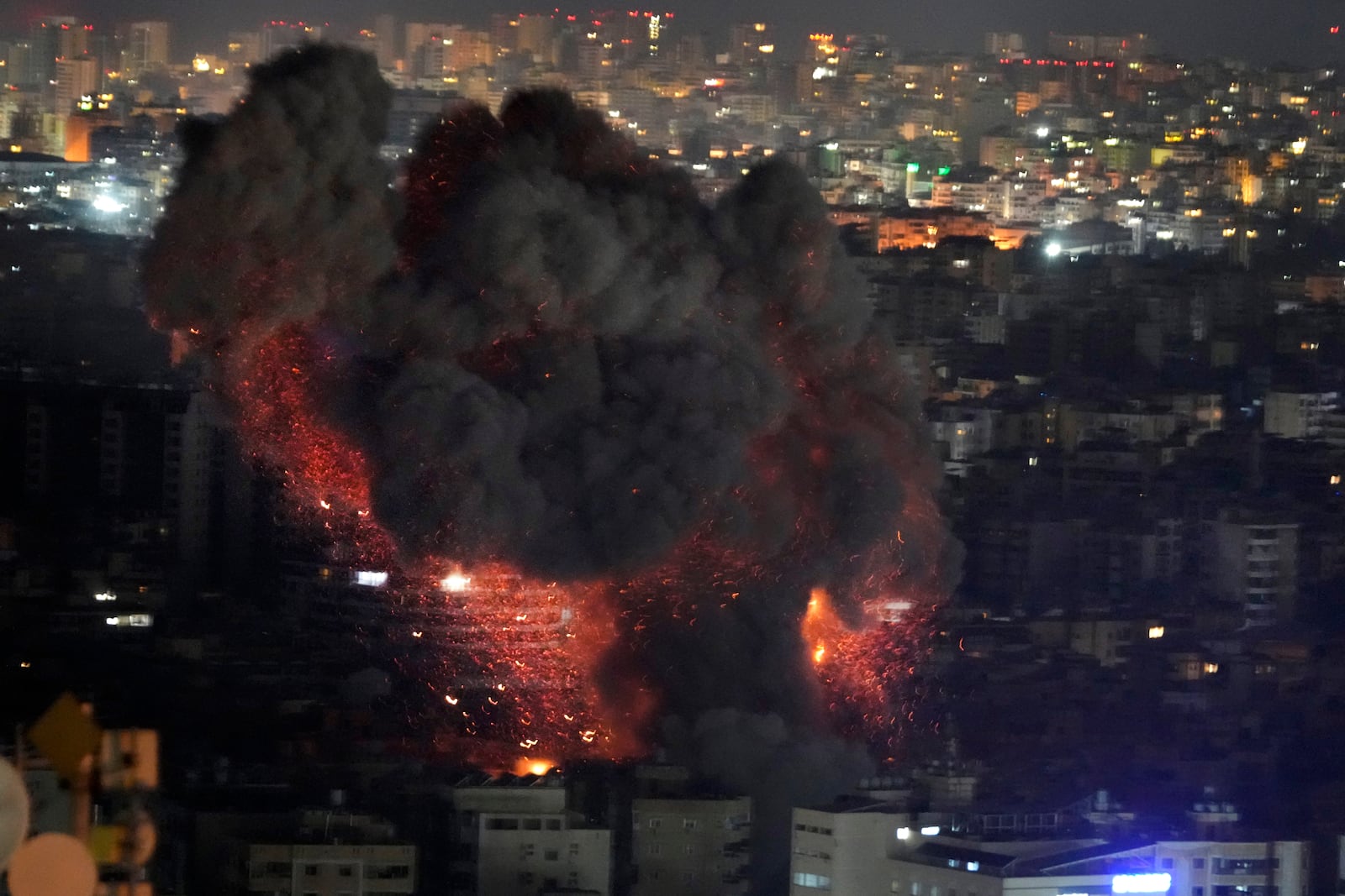 Flame and smoke rises from an Israeli airstrike on Dahiyeh, in the southern suburb of Beirut, Lebanon, early Sunday, Oct. 27, 2024. (AP Photo/Hussein Malla)