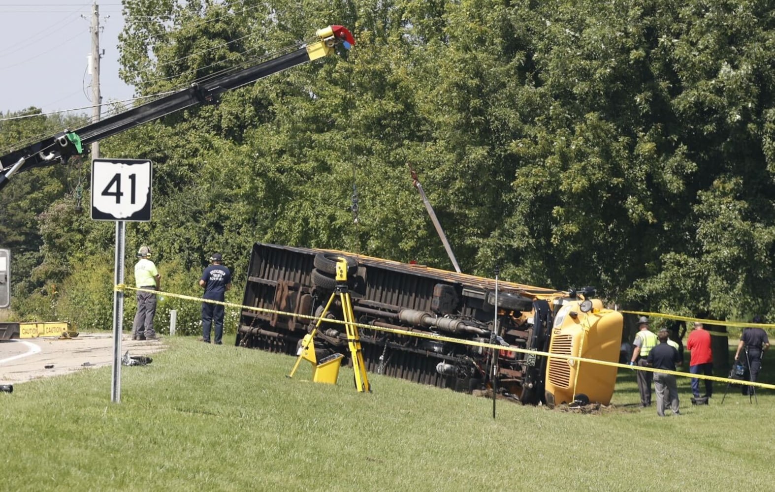 One killed after Northwestern school bus overturns in crash