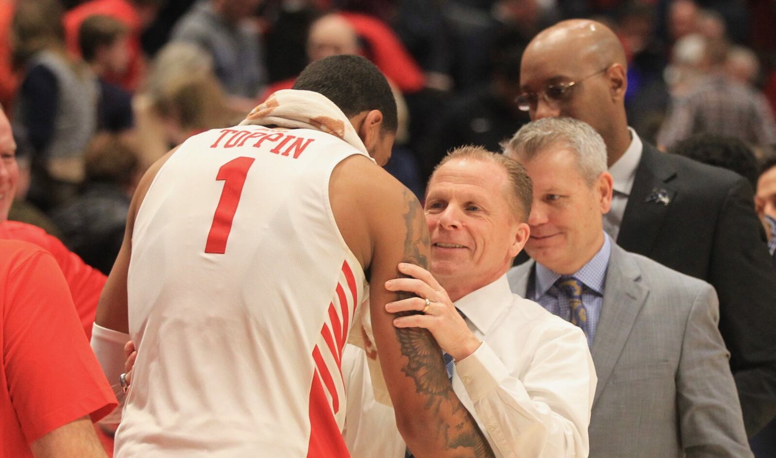 Dayton’s Obi Toppin talks to North Florida’s Matthew Driscoll after the game on Monday, Dec. 30, 2019, at UD Arena. David Jablonski/Staff