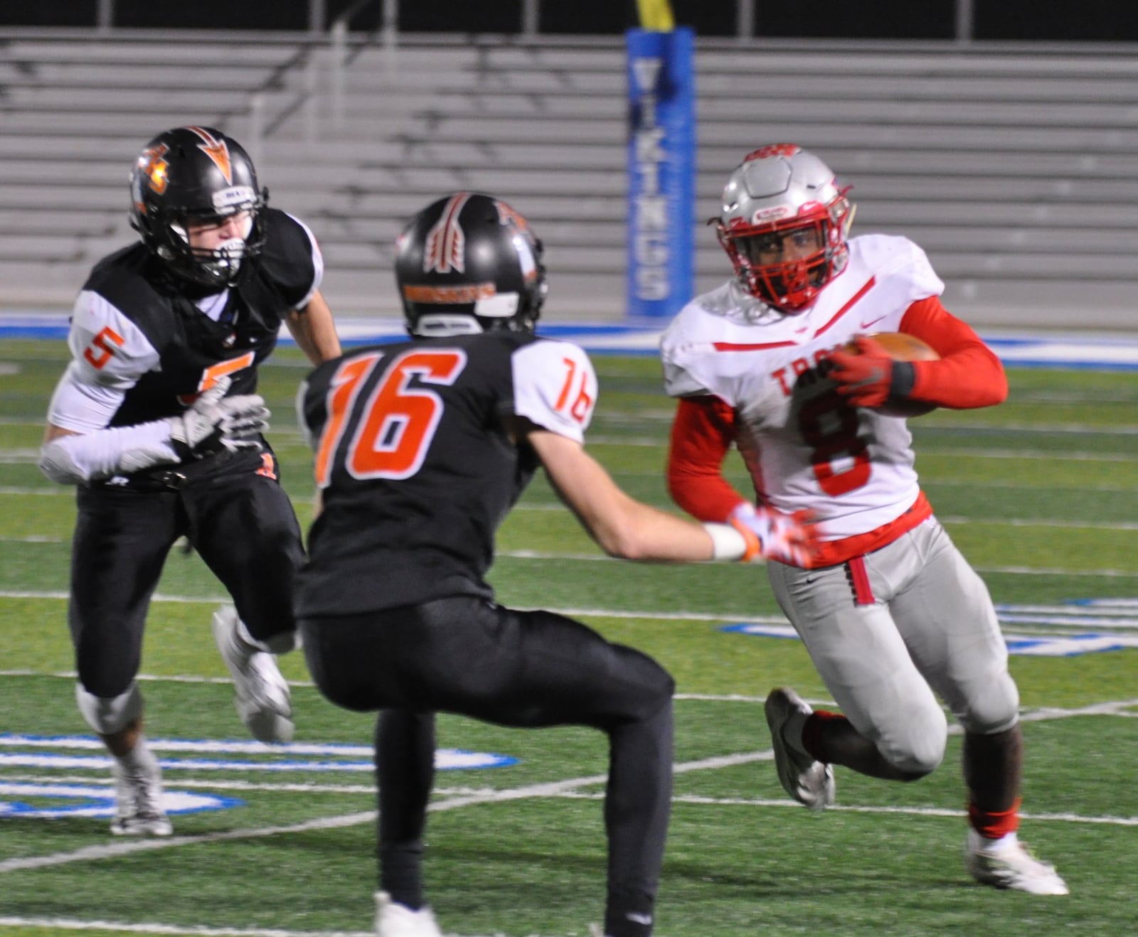 Troy running back Jaydon Culp-Bishop tries to evade Anderson defenders during the Trojans’ Division II regional semifinal at Miamisburg High School Friday, Nov. 9, 2018. Nick Dudukovich/CONTRIBUTED