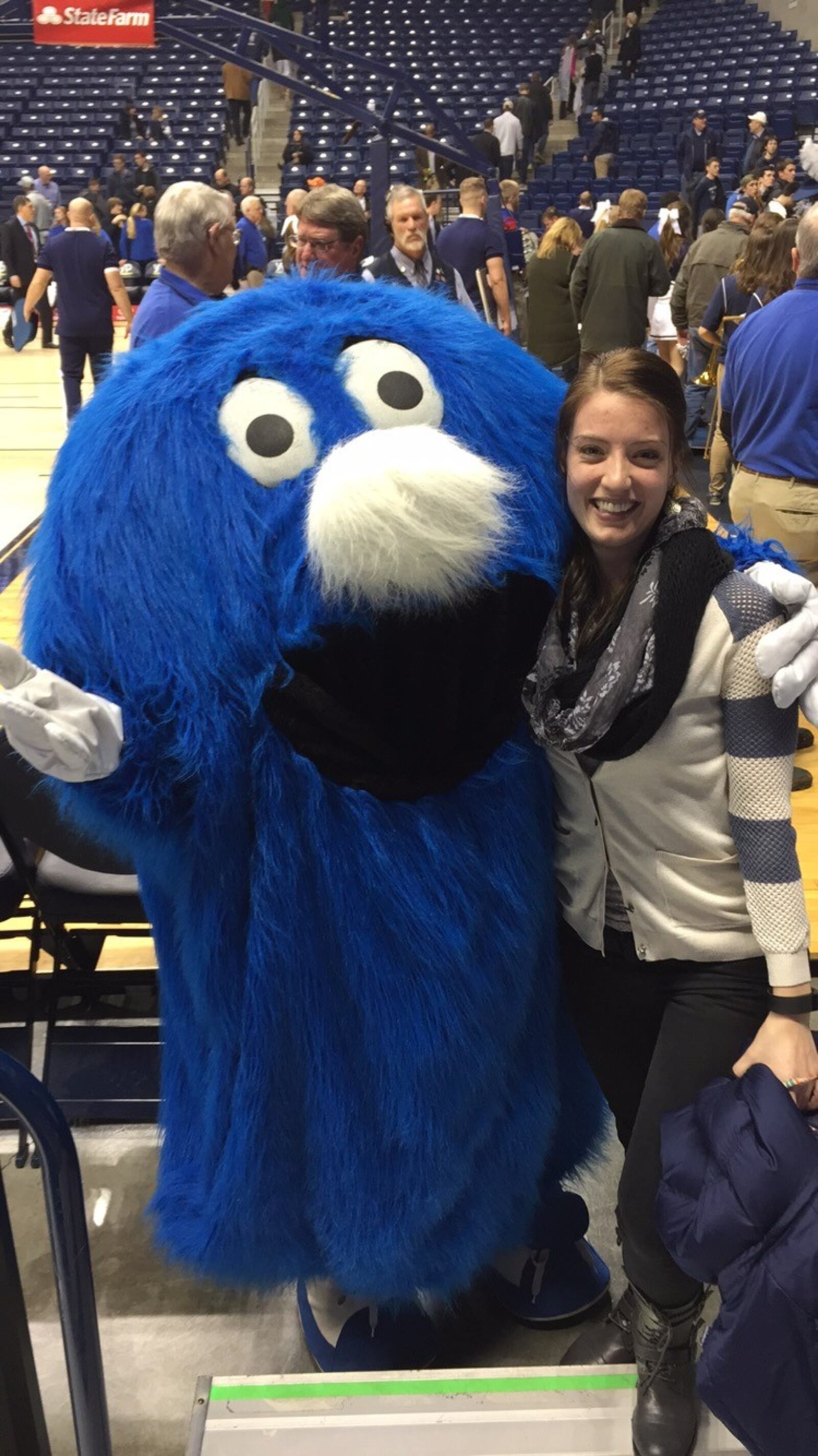 Jaclyn Meyer and the Xavier Blob in February 2015. Her husband Craig Caswell – often accompanied by her – is just two games away from completing his quest to watch a game involving each of the 363 college teams now playing Division I basketball. CONTRIBUTED