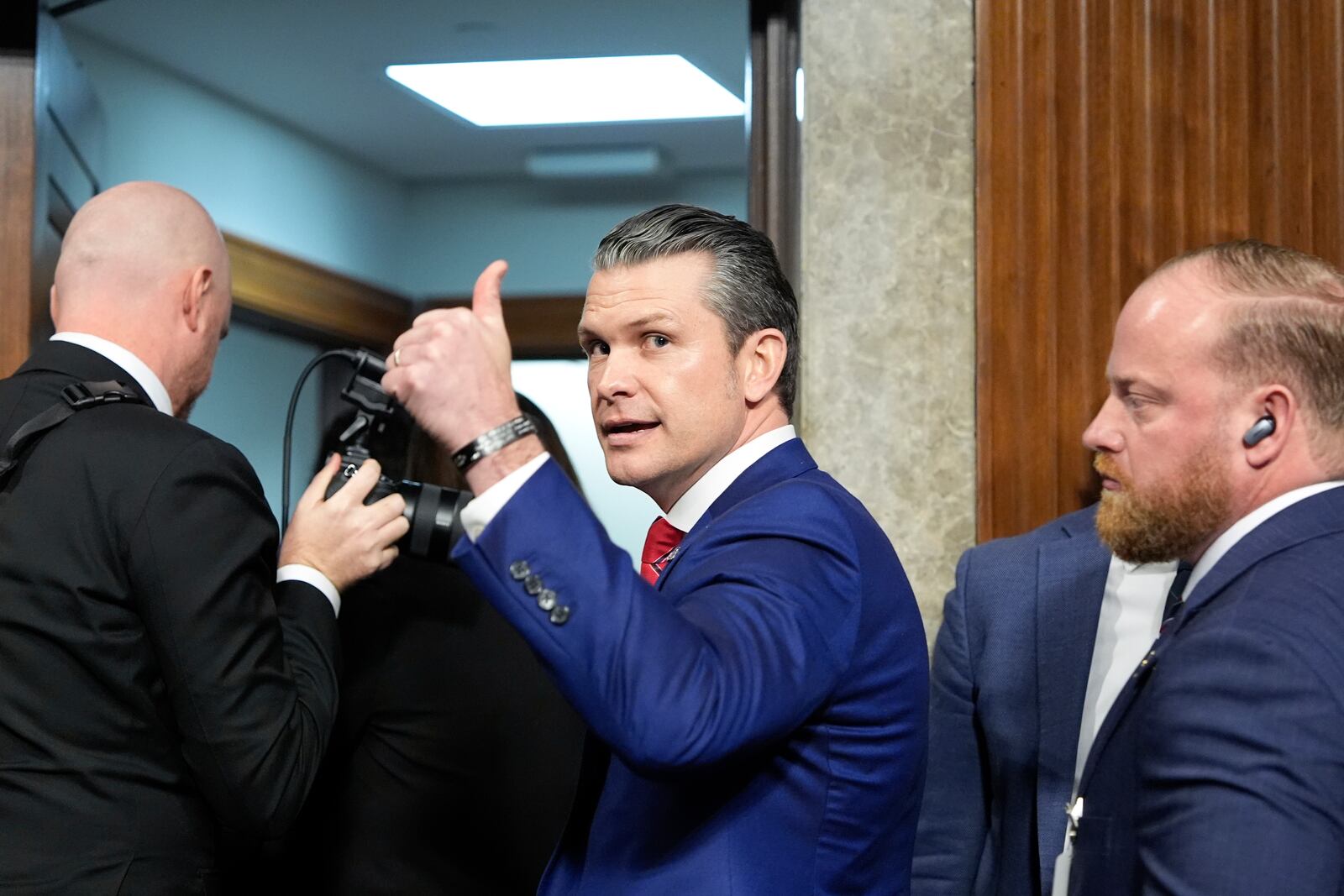 Pete Hegseth, President-elect Donald Trump's choice to be Defense secretary, gives a thumbs up while leaving after his Senate Armed Services Committee confirmation hearing, at the Capitol in Washington, Tuesday, Jan. 14, 2025. (AP Photo/Alex Brandon)