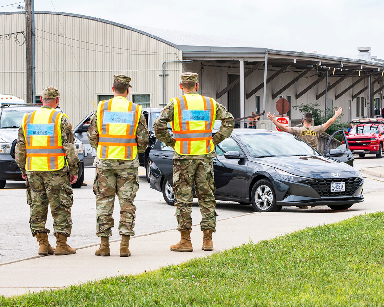 (From right) Gen. Duke Richardson, Air Force Materiel Command commander; Lt. Gen. Shaun Q. Morris, Air Force Life Cycle Management Center commander; and Col. Christopher Meeker, 88th Air Base Wing and installation commander, observe as a “gate-runner” is apprehended Aug. 22 at Wright-Patterson Air Force Base. The scenario was part of a base tour and controlled by the 88th Security Forces Squadron. U.S. AIR FORCE PHOTO/JAIMA FOGG