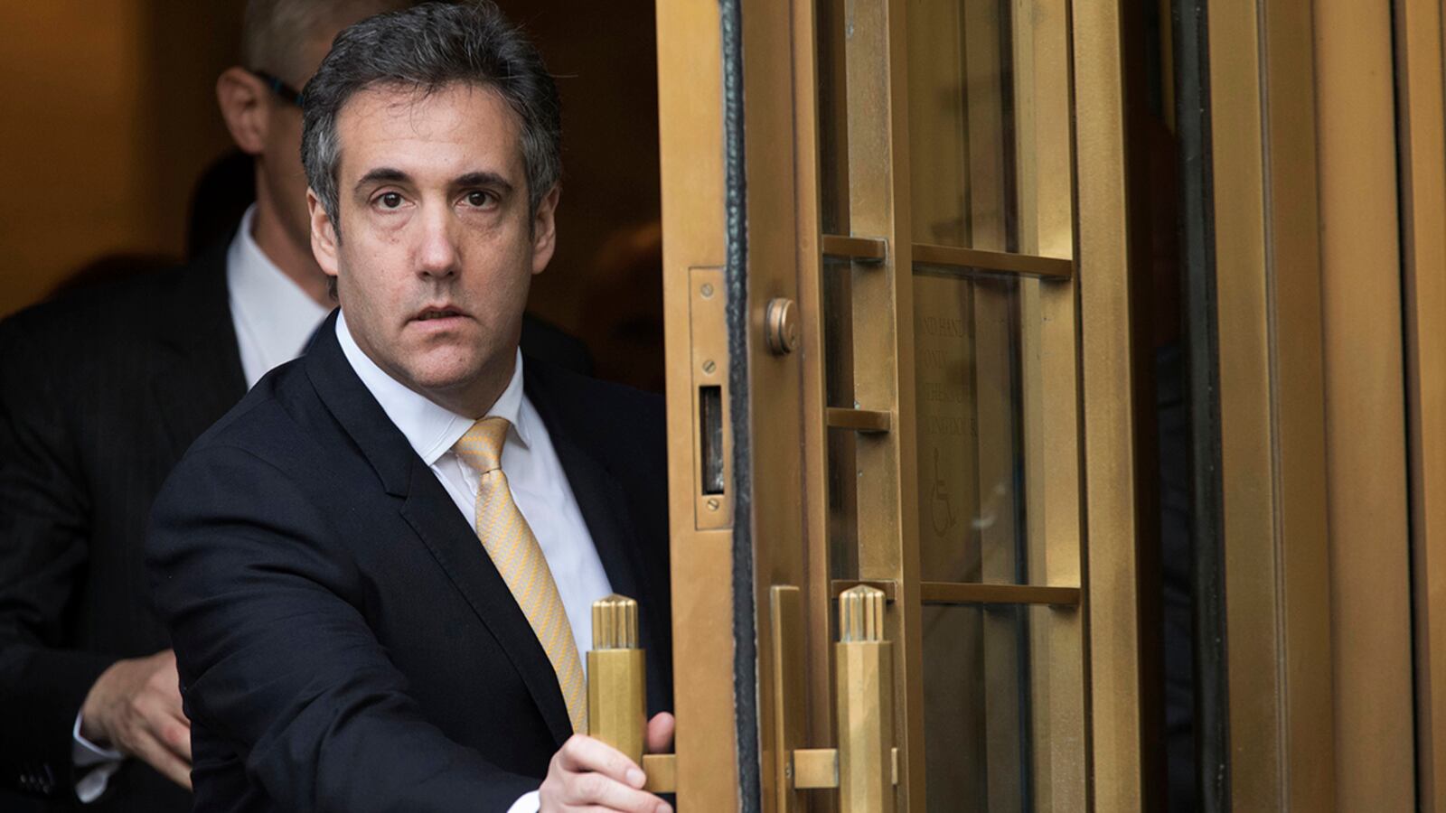 Michael Cohen leaves Federal court in New York on Aug. 21, 2018, after pleading guilty to charges including campaign finance fraud stemming from hush money payments to porn actress Stormy Daniels and ex-Playboy model Karen McDougal.