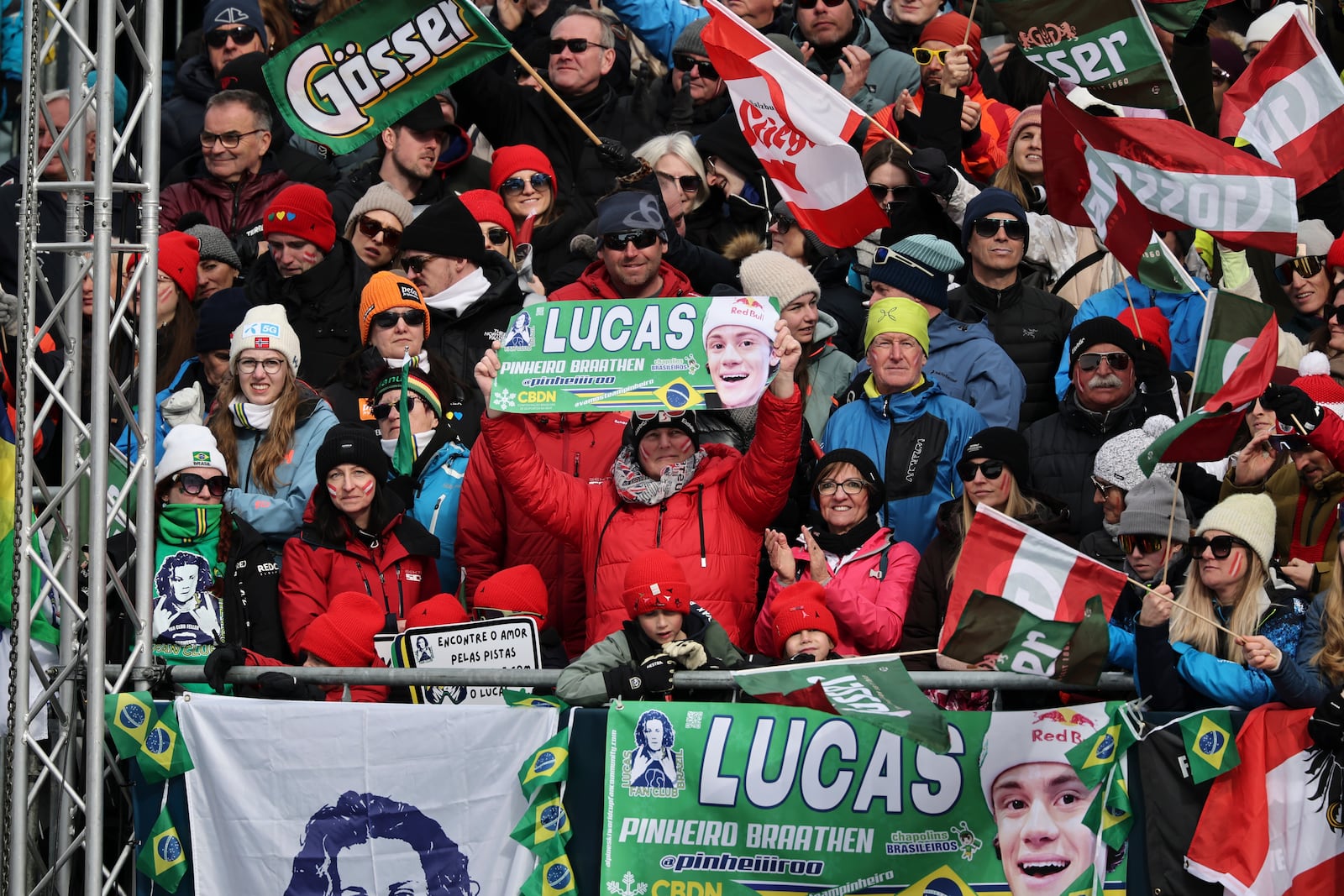 Fans of Brazil's Lucas Pinheiro Braathen cheer at the finish area of a men's slalom, at the Alpine Ski World Championships, in Saalbach-Hinterglemm, Austria, Sunday, Feb. 16, 2025. (AP Photo/Marco Trovati)