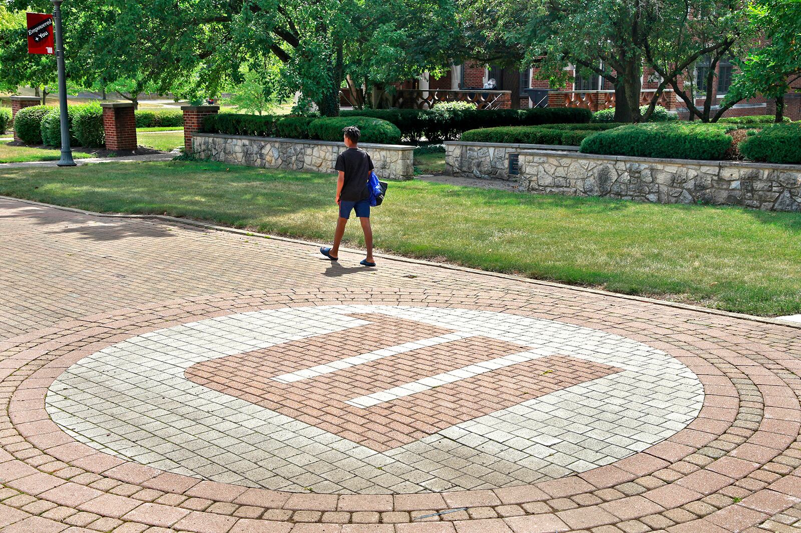 A man walks across the campus of Wittenberg University Thursday, August 1, 2024. BILL LACKEY/STAFF