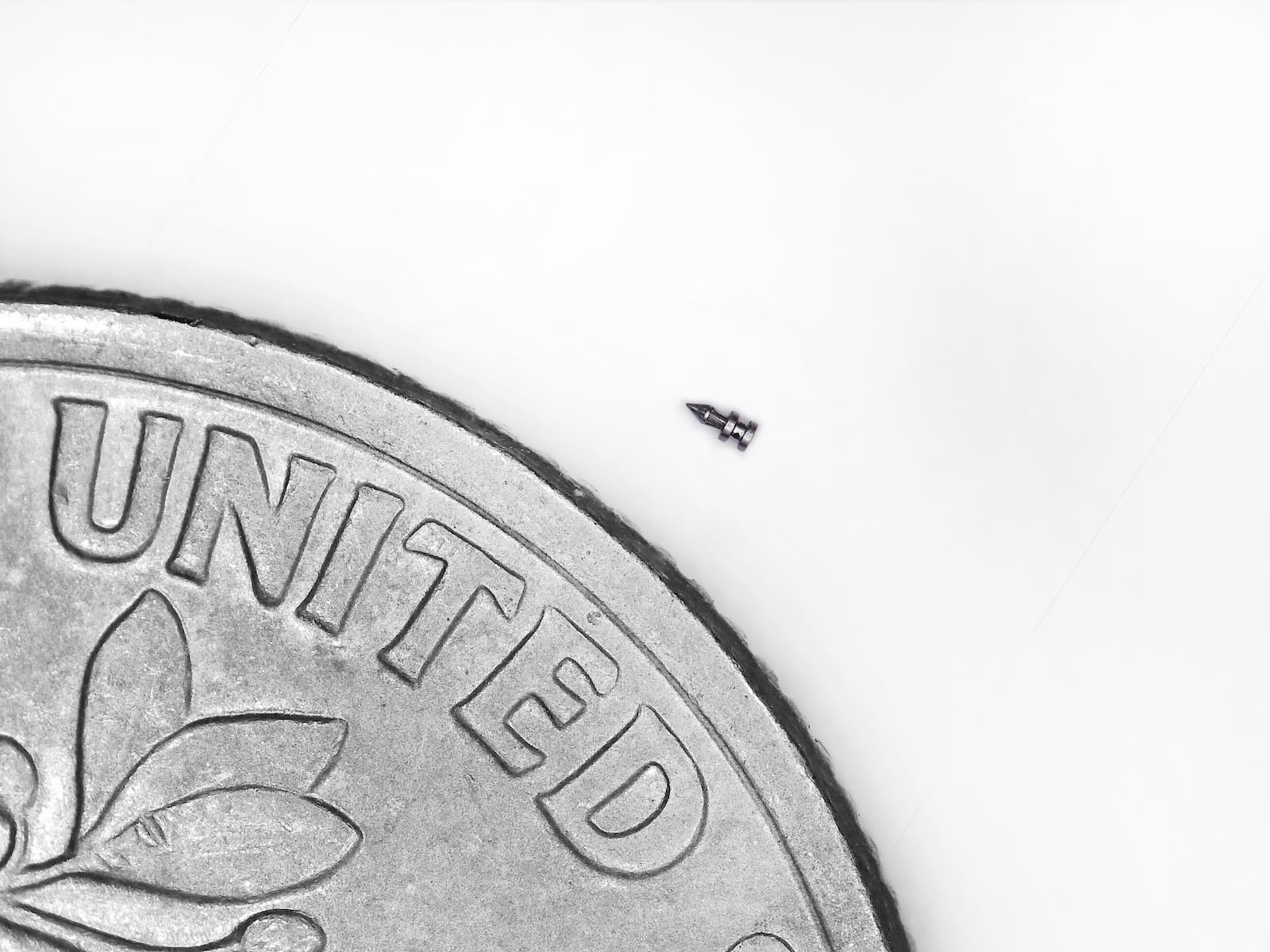 Resonetics’ Kettering location in Miami Valley Research Park makes micromedical devices. Shown here is a micro ablation tool in a photo that compares it with the size of a dime. CONTRIBUTED