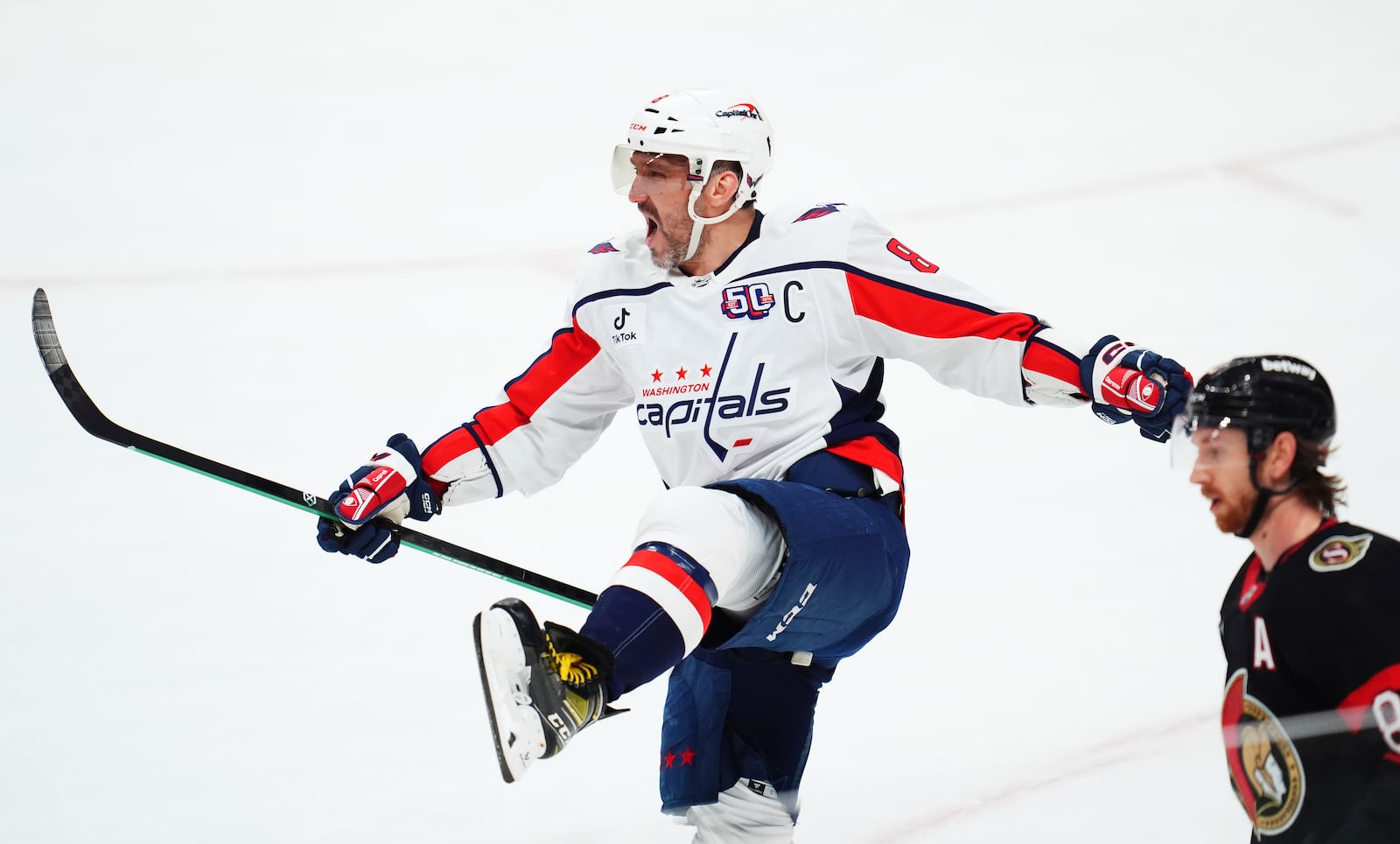 Washington Capitals' Alex Ovechkin (8) celebrates after his winning goal against the Ottawa Senators during third-period NHL hockey game action in Ottawa, Ontario, Thursday, Jan. 16, 2025. (Sean Kilpatrick/The Canadian Press via AP)