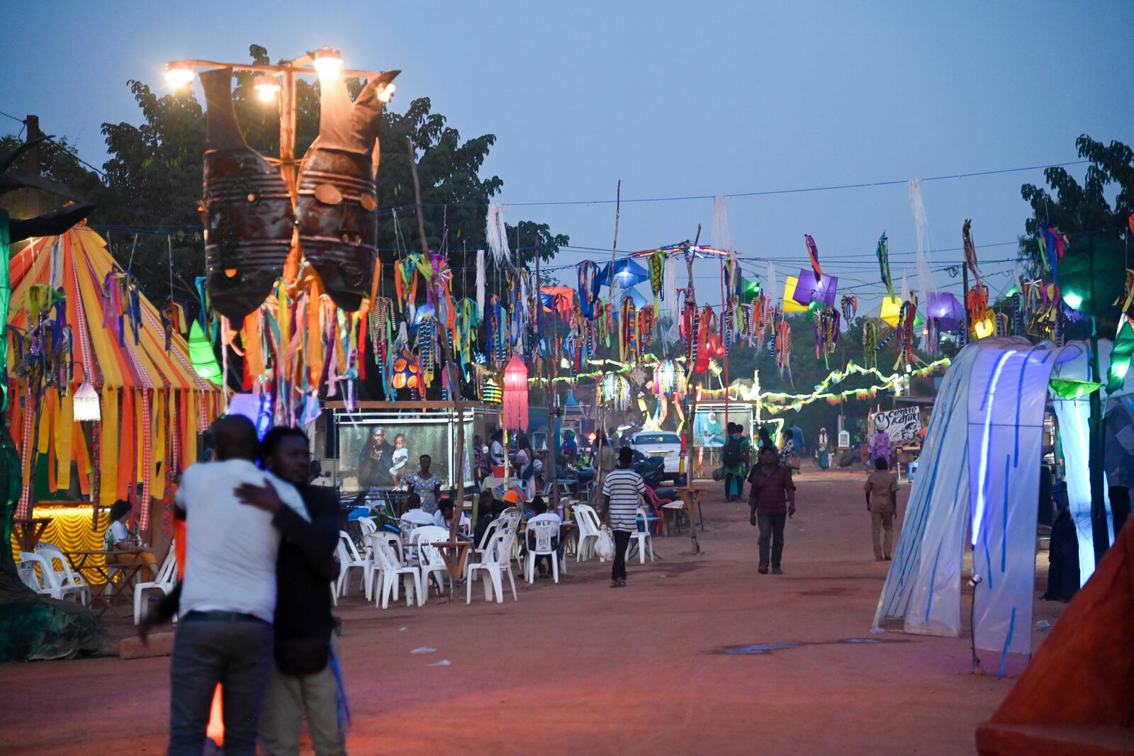 People gather for Recreatrales, an international theater festival held in Ouagadougou, Burkina Faso, Monday, Oct. 28, 2024. (AP Photo/Kilaye Bationo)