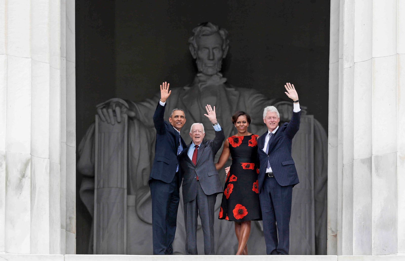 FILE - From left, President Barack Obama, former President Jimmy Carter, first lady Michelle Obama and former President Bill Clinton wave from the Lincoln Memorial in Washington during a celebration of the 50th anniversary of the March on Washington where Martin Luther King Jr. spoke, Aug. 28, 2013. (AP Photo/Charles Dharapak, File)