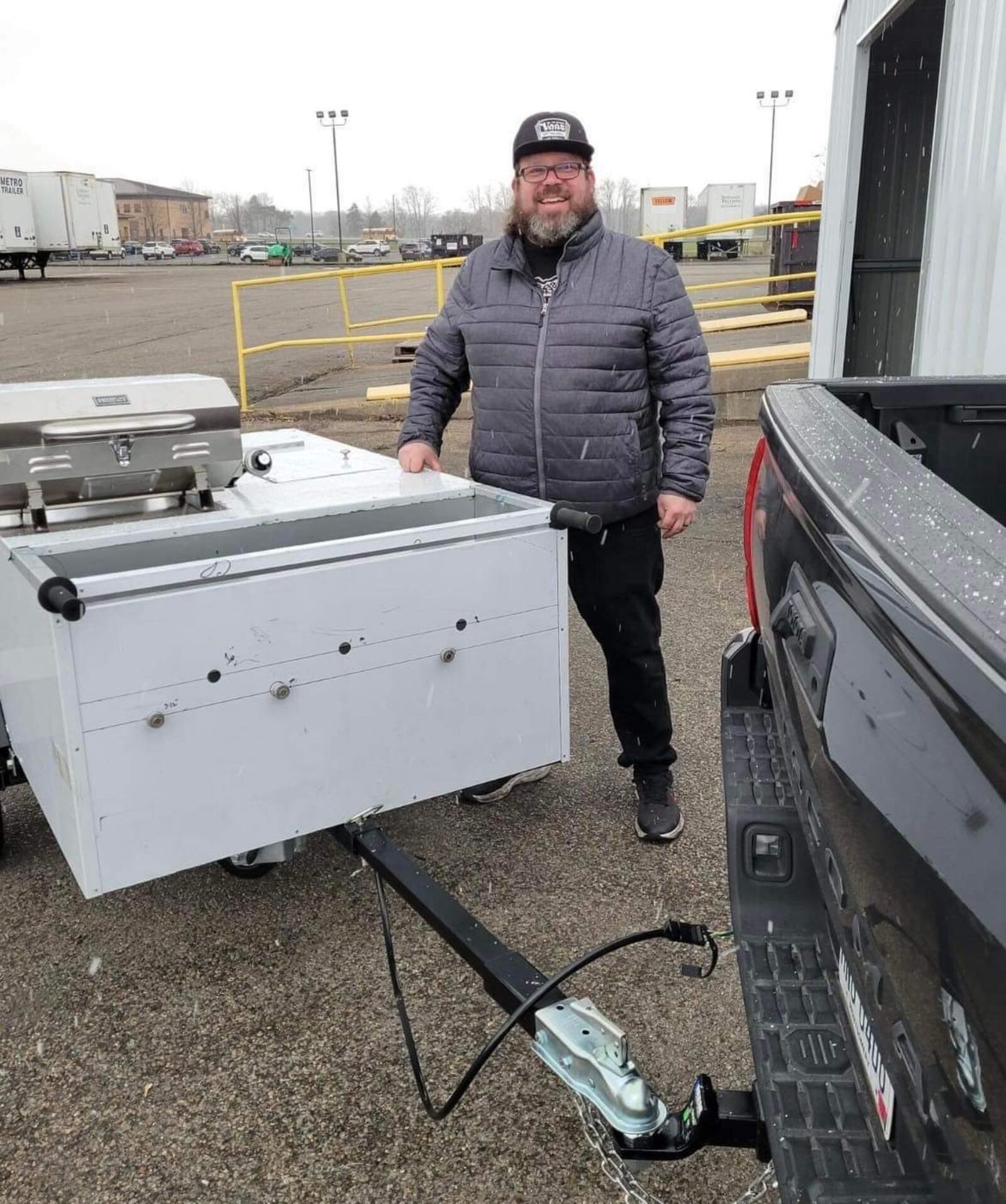 Chef Ashley Ashbrook receives his hot dog cart. CONTRIBUTED