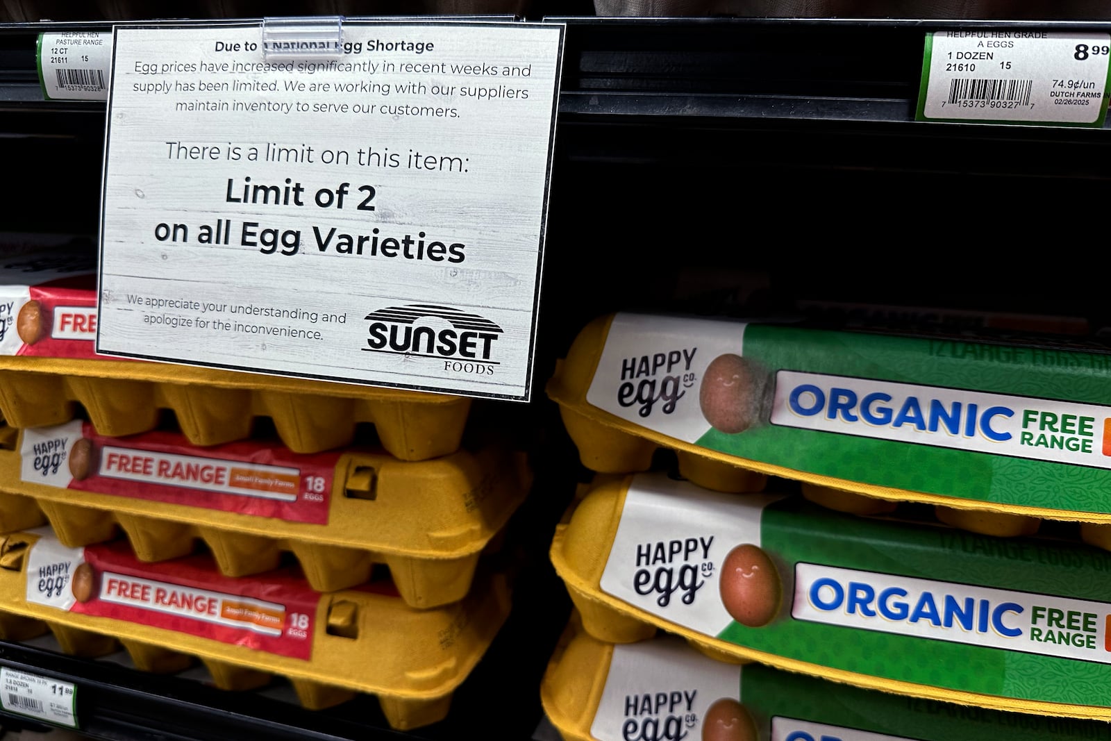 A sign is mounted on a shelve of eggs at a grocery store in Northbrook, Ill., Friday, Feb. 28, 2025. (AP Photo/Nam Y. Huh)