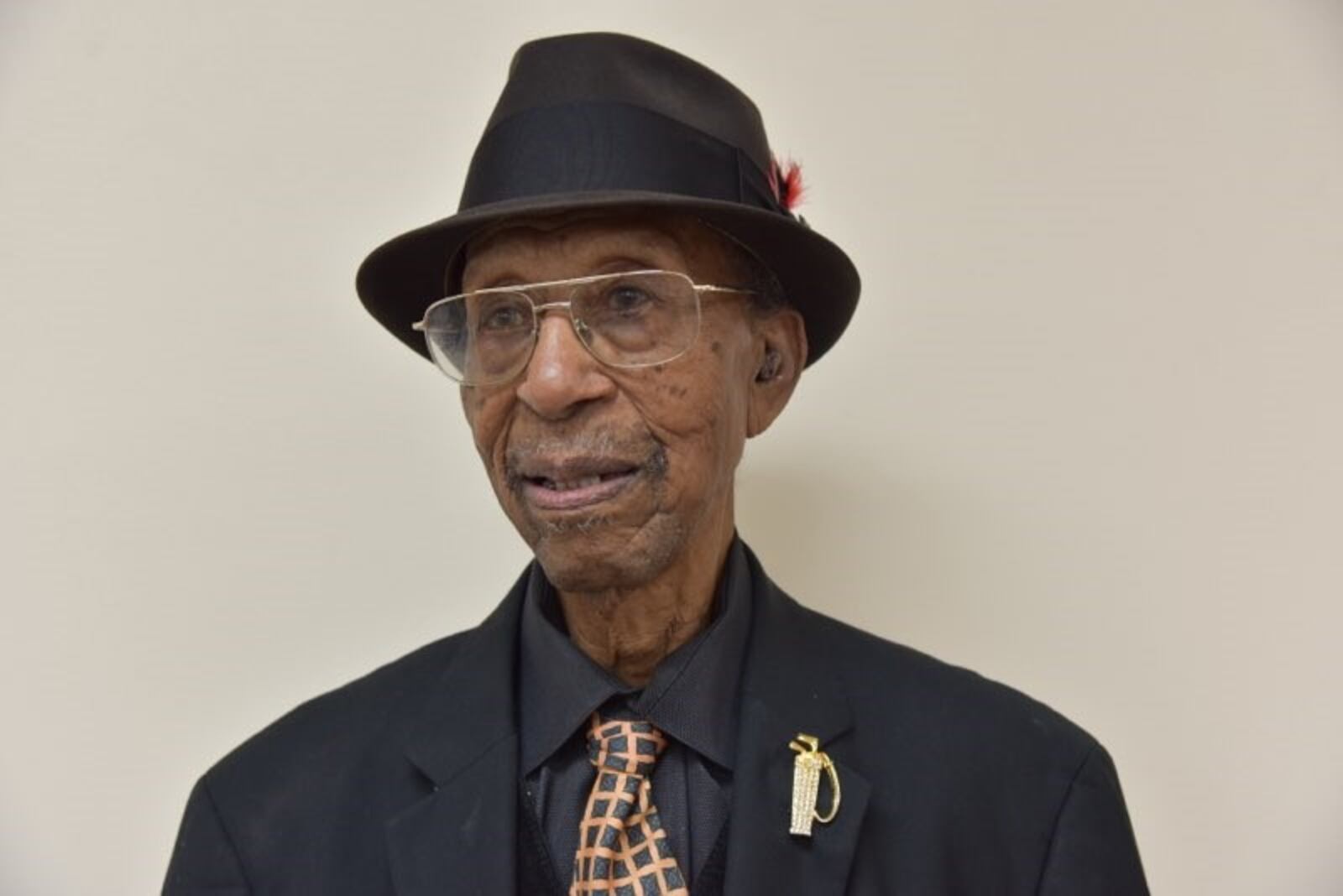 Marion Miller, a West Dayton World War II veteran who turned 100, on Wednesday at his gala birthday party Saturday at St, Margaret’s Episcopal Church on Free Pike. He still plays golf, a sport he saluted with his bejeweled golf bag lapel pin.  CONTRIBUTED