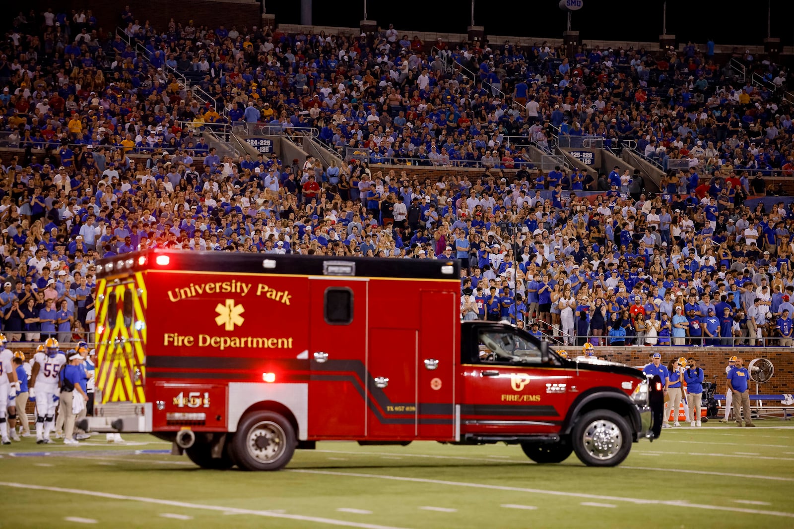 SMU cornerback AJ Davis is taken off the field by ambulance after sustaining an injury during the first half of an NCAA college football game against Pittsburgh in Dallas, Saturday, Nov. 2, 2024. (AP Photo/Gareth Patterson)