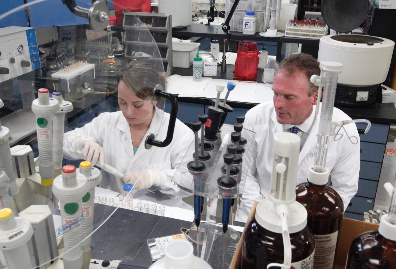 Montgomery County Coroner Dr. Kent Harshbarger, pictured with Kialee Bowles, a forensic toxicologist, said fentanyl and ever-stronger analogues are responsible for the increase in overdose deaths during 2016. STAFF / CHRIS STEWART