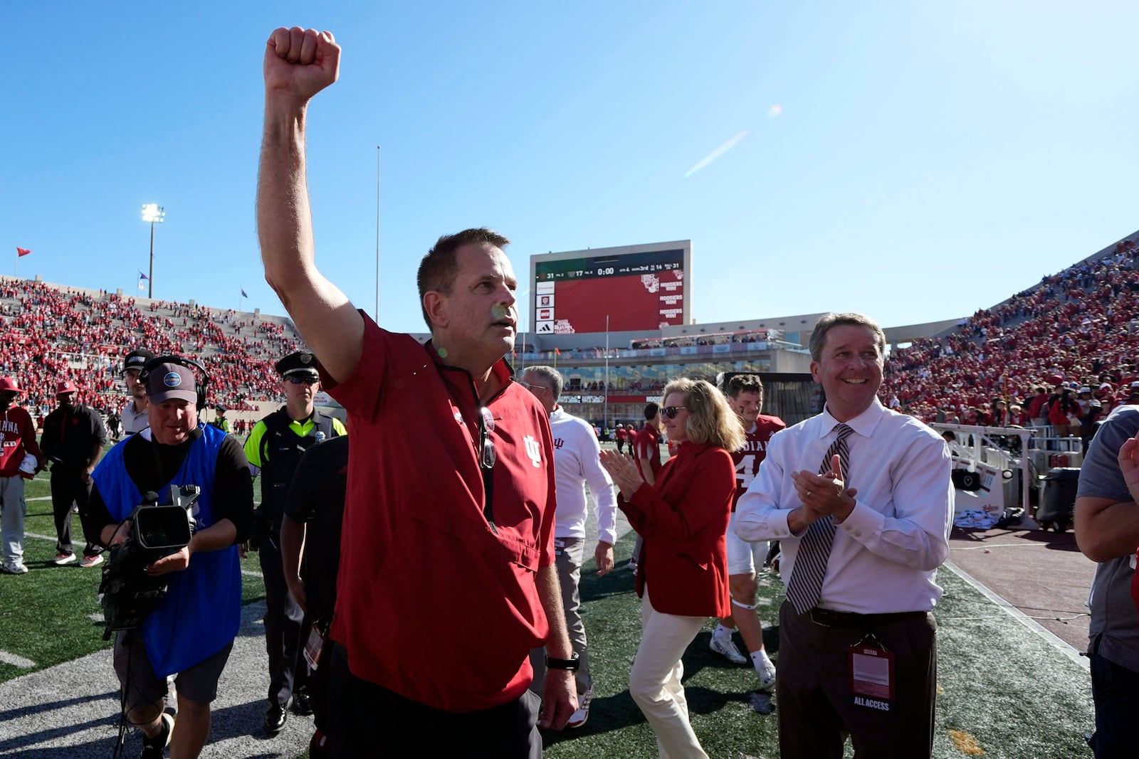 Indiana head coach Curt Cignetti celebrates as he leaves the field following an NCAA college football game against Washington, Saturday, Oct. 26, 2024, in Bloomington, Ind. (AP Photo/Darron Cummings)