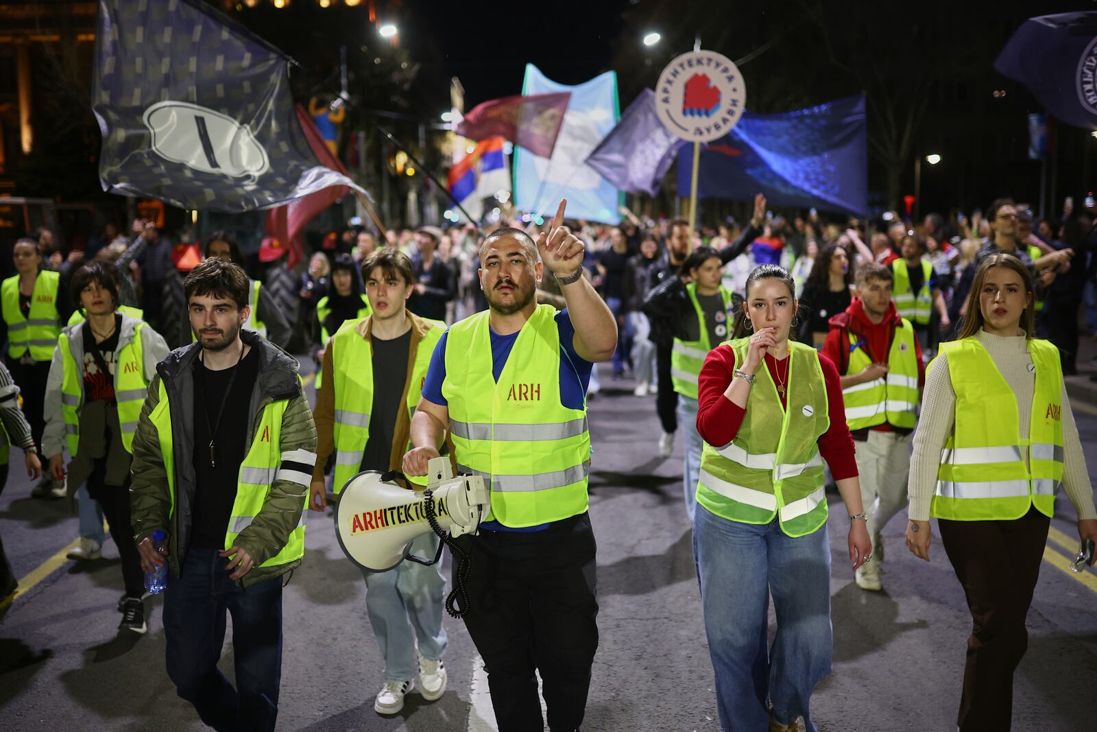 Students and other protesters who have arrived ahead of a major rally this weekend march in downtown Belgrade, Serbia, Friday, March 14, 2025. (AP Photo/Armin Durgut)