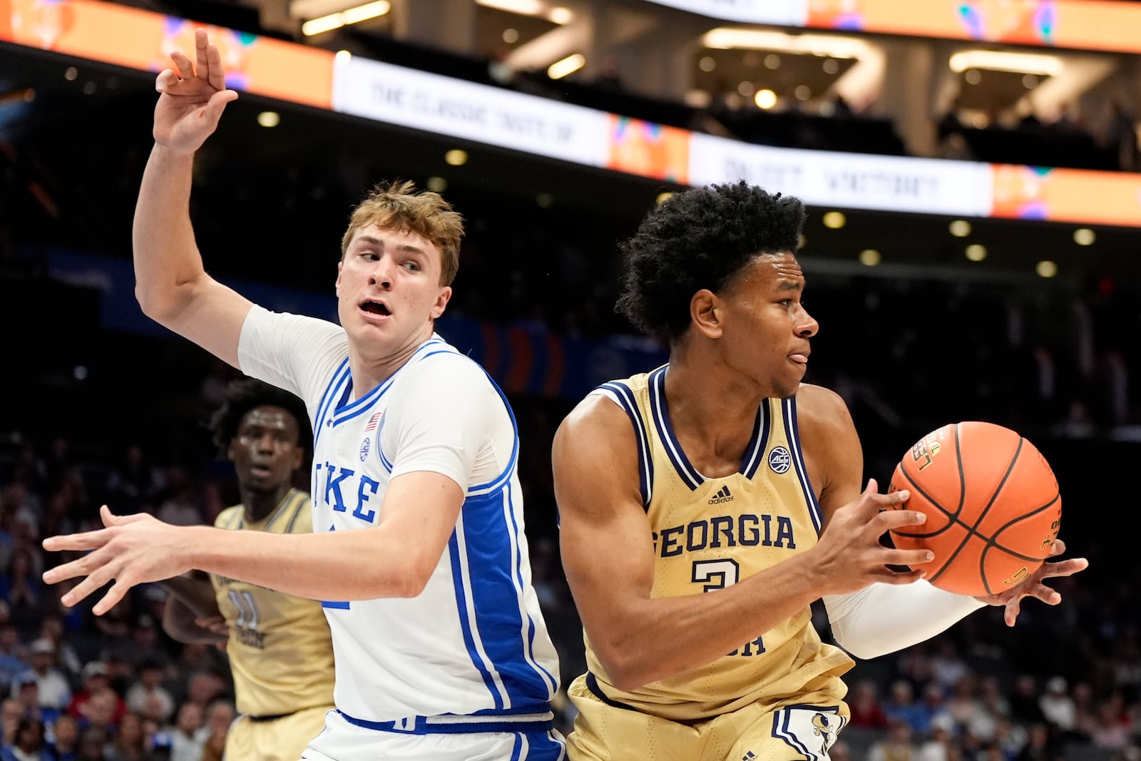 Georgia Tech guard Jaeden Mustaf drives to the basket past Duke forward Cooper Flagg during the first half of an college basketball game in the quarterfinals of the Atlantic Coast Conference tournament, Thursday, March 13, 2025, in Charlotte, N.C. (AP Photo/Chris Carlson)