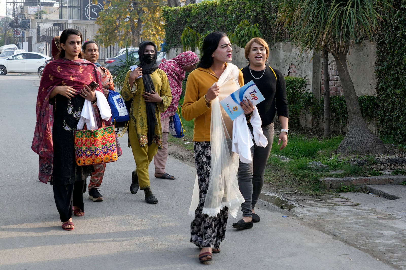 Transgender persons arrive to attend their cooking class at the Culinary & Hotel Institute of Pakistan, in Lahore, Pakistan, Tuesday, Feb. 25, 2025. (AP Photo/K.M Chaudary)