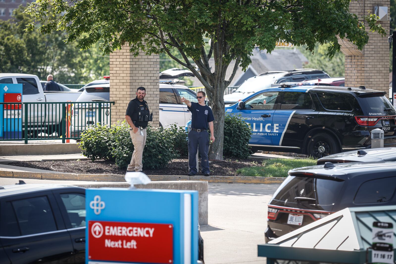 Police are outside the emergency department of Miami Valley Hospital on Wednesday morning, June 1, 2022, after a Montgomery County Jail inmate and a private security guard died in a shooting at the hospital. JIM NOELKER/STAFF