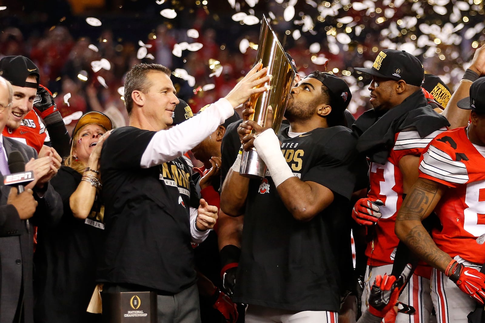 ARLINGTON, TX - JANUARY 12:  Running back Ezekiel Elliott #15 of the Ohio State Buckeyes celebrates with the trophy after defeating the Oregon Ducks 42 to 20 in the College Football Playoff National Championship Game at AT&T Stadium on January 12, 2015 in Arlington, Texas.  (Photo by Christian Petersen/Getty Images)