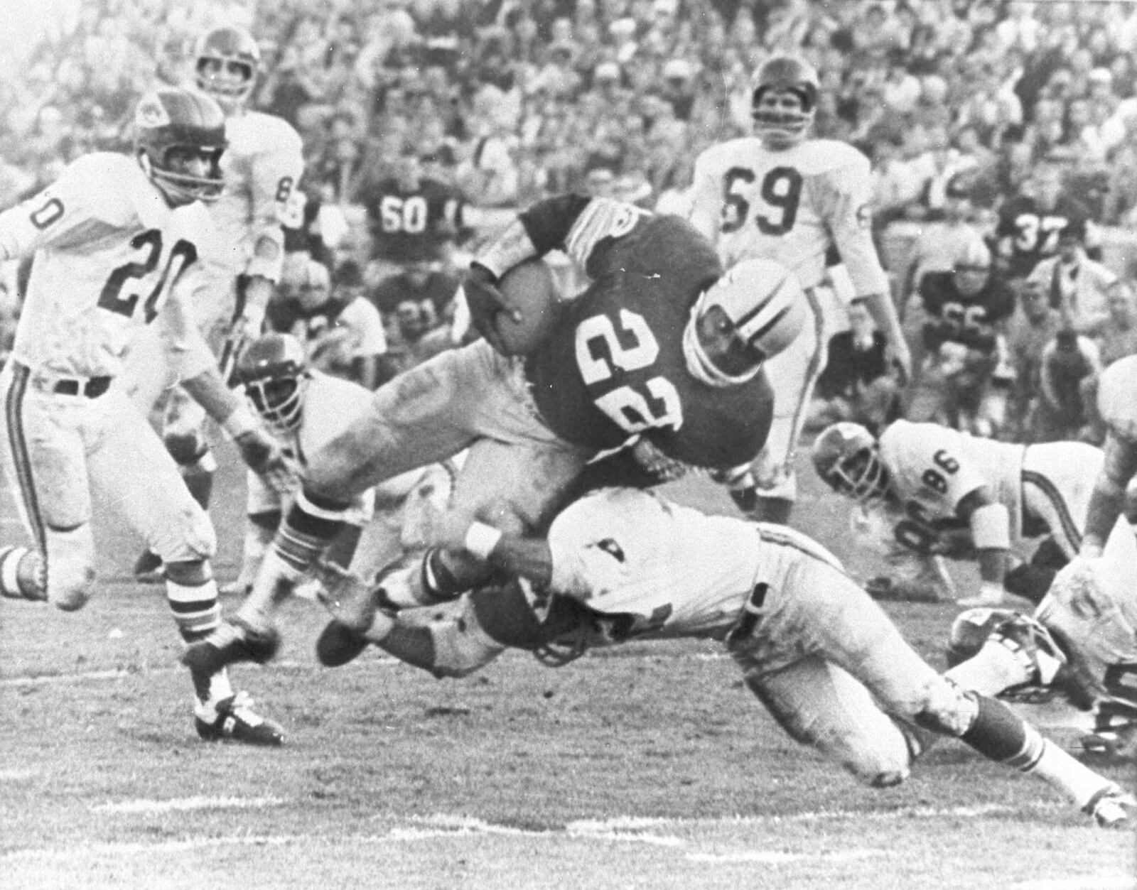 FILE - In this Jan. 15, 1967, file photo, Green Bay Packers' Klijah Pitts (22) goes over right tackle to the Kansas City Chiefs' five-yard line, for a six-yard gain before being brought down by Kansas City's Johnny Robinson in the fourth quarter of Super Bowl I in Los Angeles. (AP Photo/File)