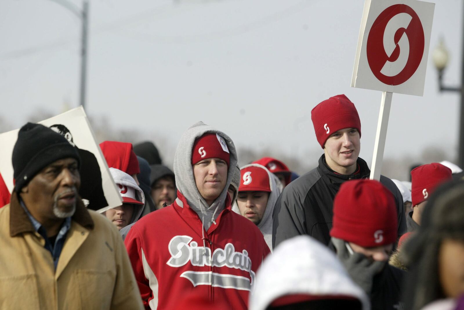 Sinclair Community College baseball coach Steve Dintaman (left) and pitcher Alex Kimsey (right) along with other members of the team, took part in the 25th Annual MLK Memorial March held in Dayton. CONTRIBUTED