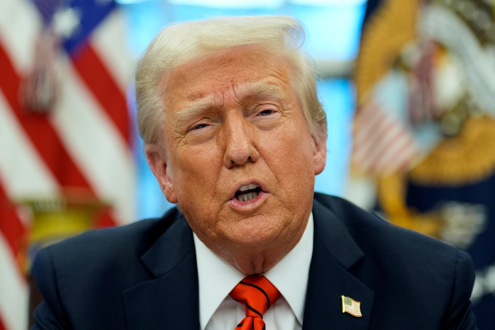 President Donald Trump speaks with reporters as he signs an executive order in the Oval Office at the White House, Monday, Feb. 10, 2025, in Washington. (Photo/Alex Brandon)