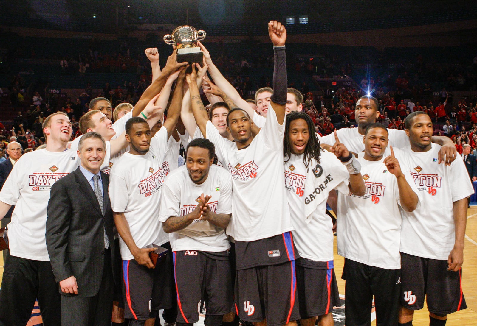 The Dayton team poses for photographs after defeating North Carolina 79-68 in a college basketball game for the NIT title Thursday, April 1, 2010, in New York. (AP Photo/Frank Franklin II) 2010 Dayton NIT 4.JPG