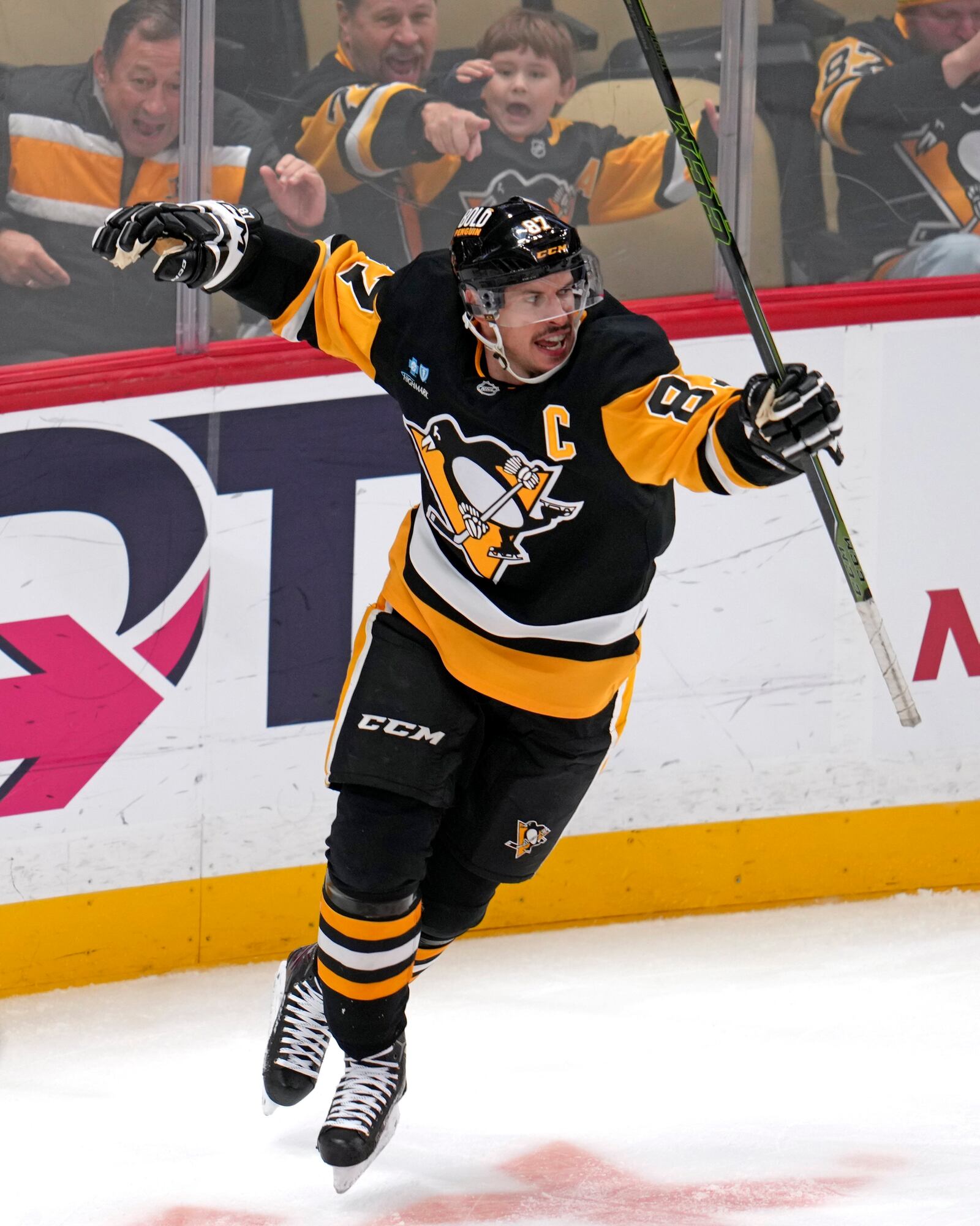 Pittsburgh Penguins' Sidney Crosby (87) celebrates after getting his 600th career goal in the NHL during the second period of an NHL hockey game against the Utah Hockey Club, Saturday, Nov. 23, 2024, in Pittsburgh. (AP Photo/Gene J. Puskar)