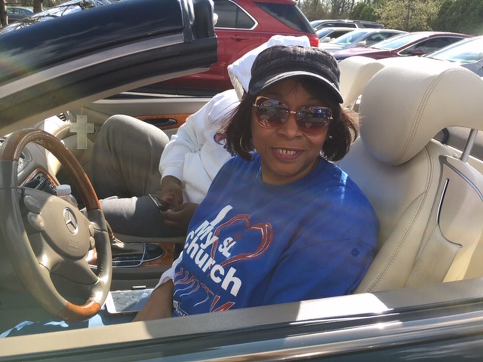 Sharri Golson was among the congregants who sat in their cars during a “worship on wheels” service in the parking lot of St. Luke Missionary Baptist Church Sunday in Dayton. THOMAS GNAU/STAFF