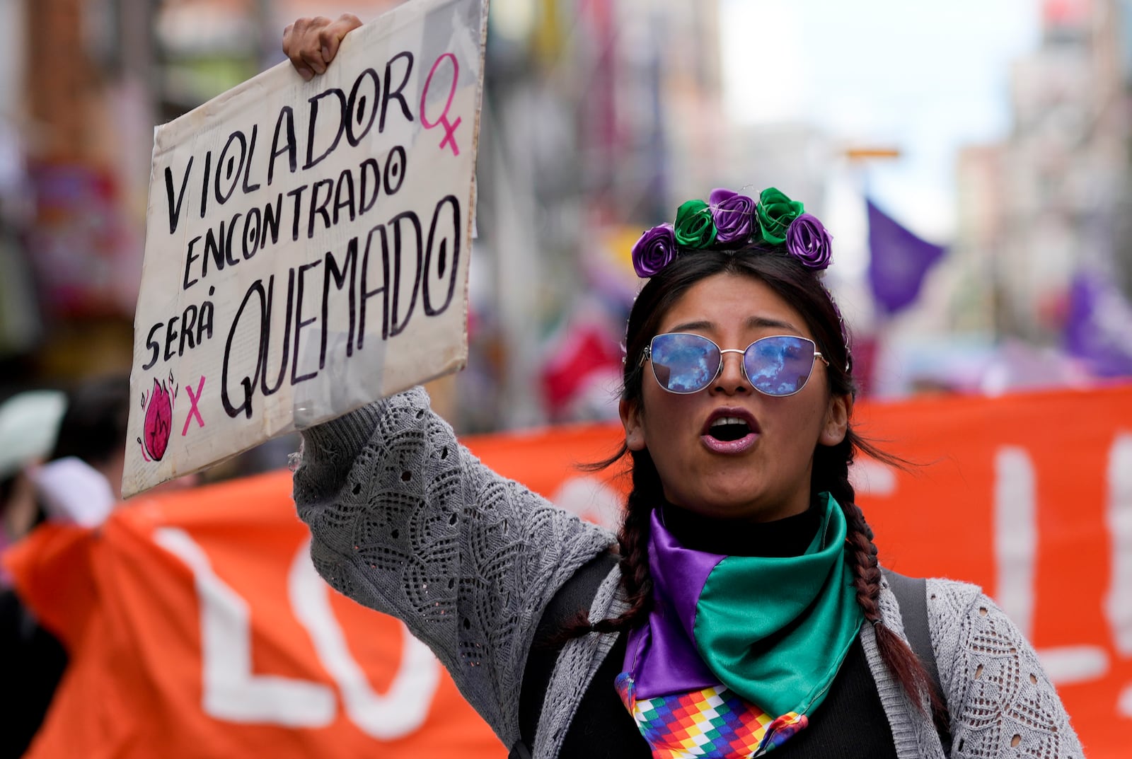 A woman chants slogans during a march marking the International Day for the Elimination of Violence against Women in El Alto, Bolivia, Monday, Nov. 25, 2024. (AP Photo/Juan Karita)