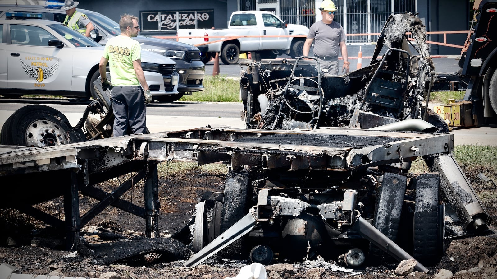 A truck driver escaped with minor injuries Wednesday, Aug. 21, 2024, when the cab of a semitractor-trailer burst into flames after a rear-end crash on U.S. 40 at Upper Valley Pike near Springfield in Clark County. MARSHALL GORBY\STAFF