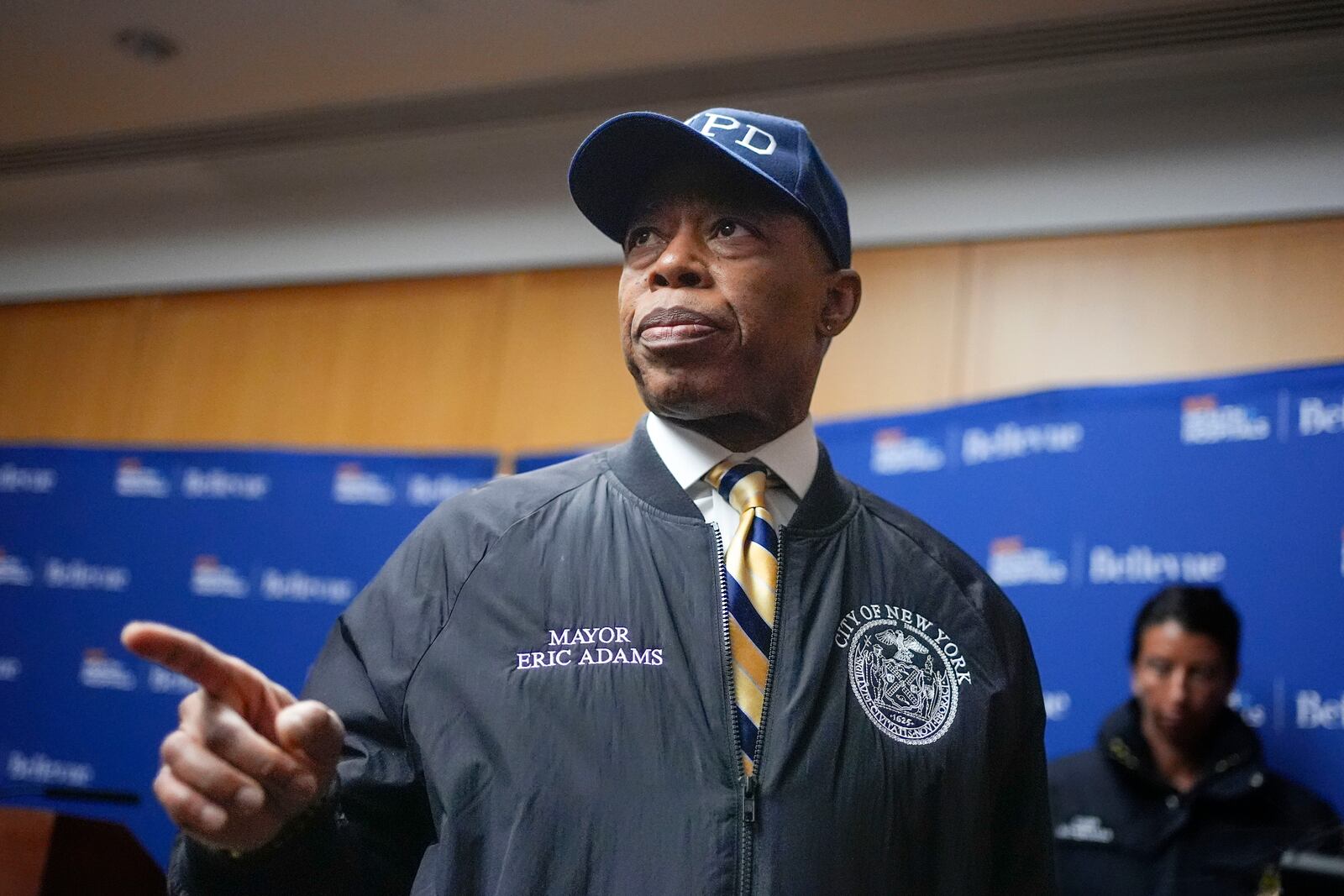 New York City mayor Eric Adams speaks to reporters as he leaves a news conference in New York, Tuesday, Feb. 18, 2025. (AP Photo/Seth Wenig)