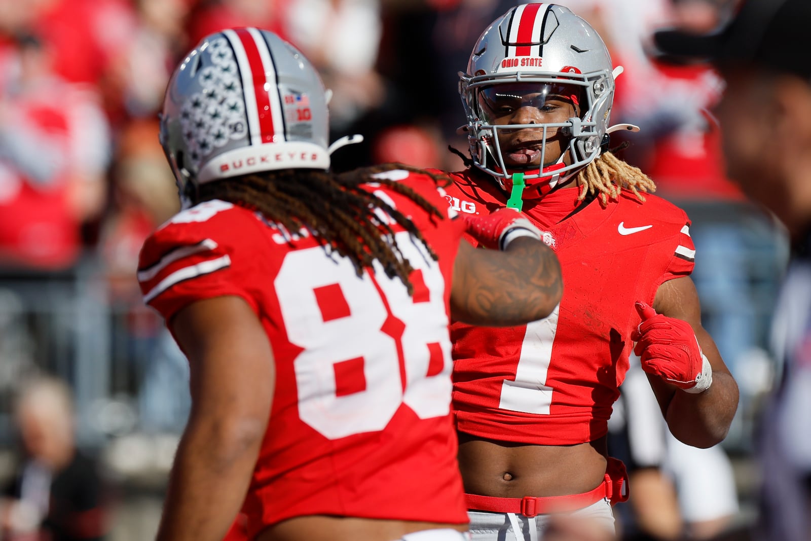 Ohio State running back Quinshon Judkins, right, celebrates his touchdown against Nebraska with teammate tight end Gee Scott during the second half of an NCAA college football game Saturday, Oct. 26, 2024, in Columbus, Ohio. (AP Photo/Jay LaPrete)