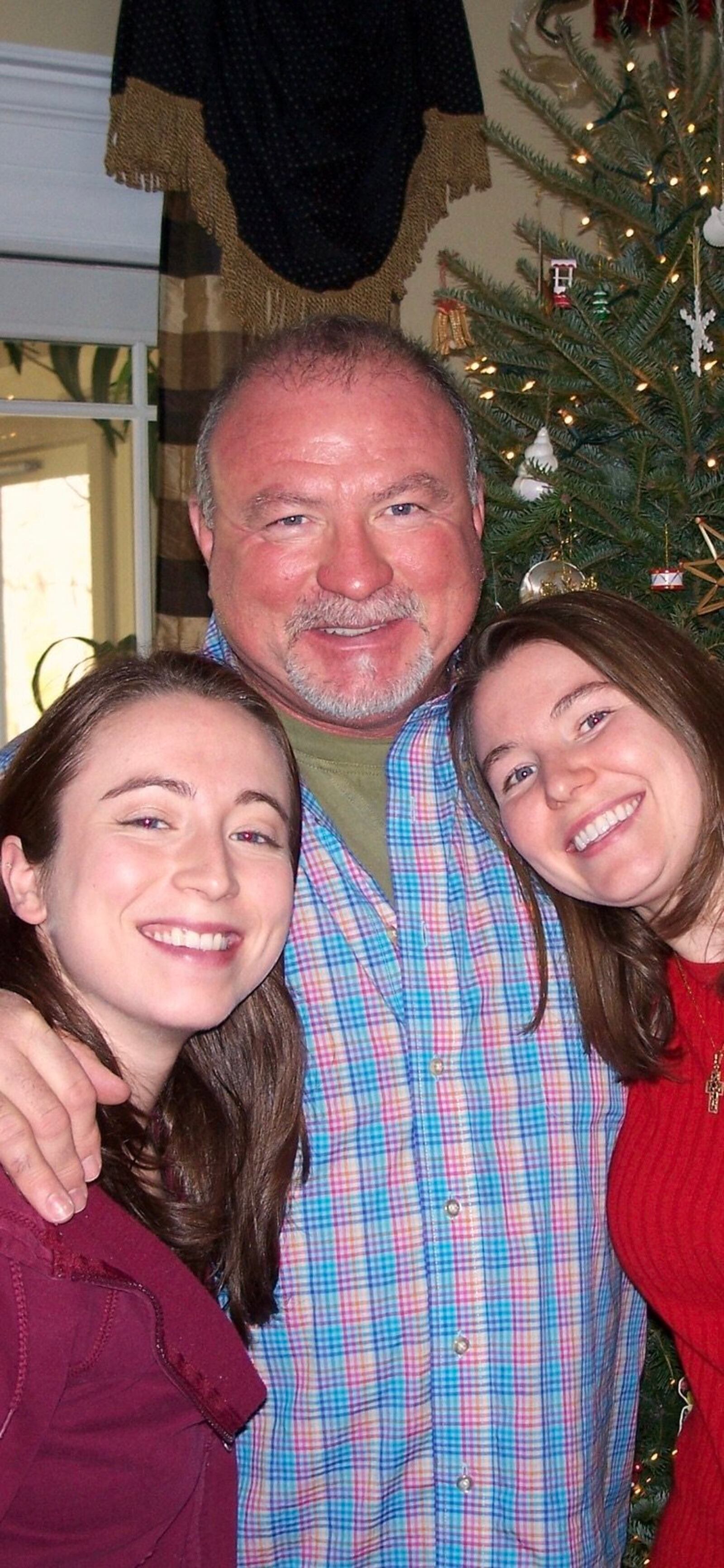 After Lynn Faulkner's wife, Wendy, was killed during the 9/11 attacks in New York, his daughters, ? and ?, referred to him as "?" because of his double roles. SUBMITTED PHOTO