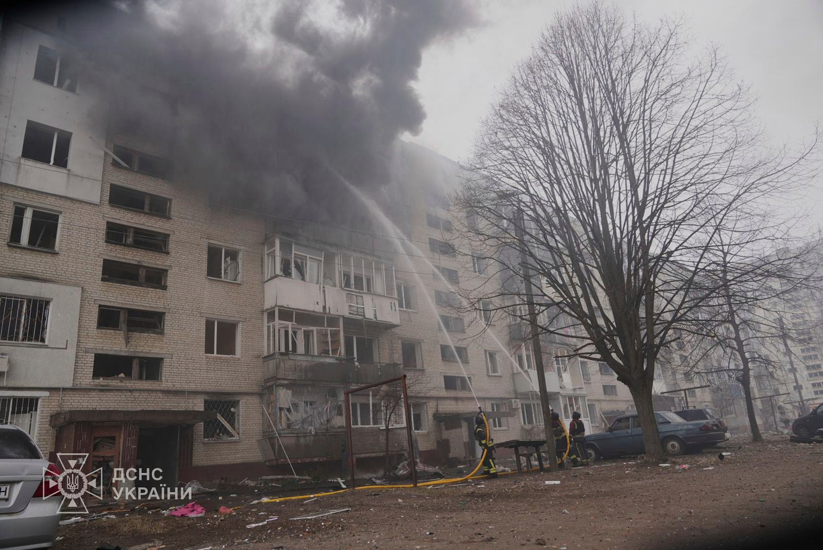 In this photo provided by the Ukrainian Emergency Service, firefighters put out the fire following a Russian attack in Sumy, Ukraine, Tuesday, March 25, 2025. (Ukrainian Emergency Service via AP)